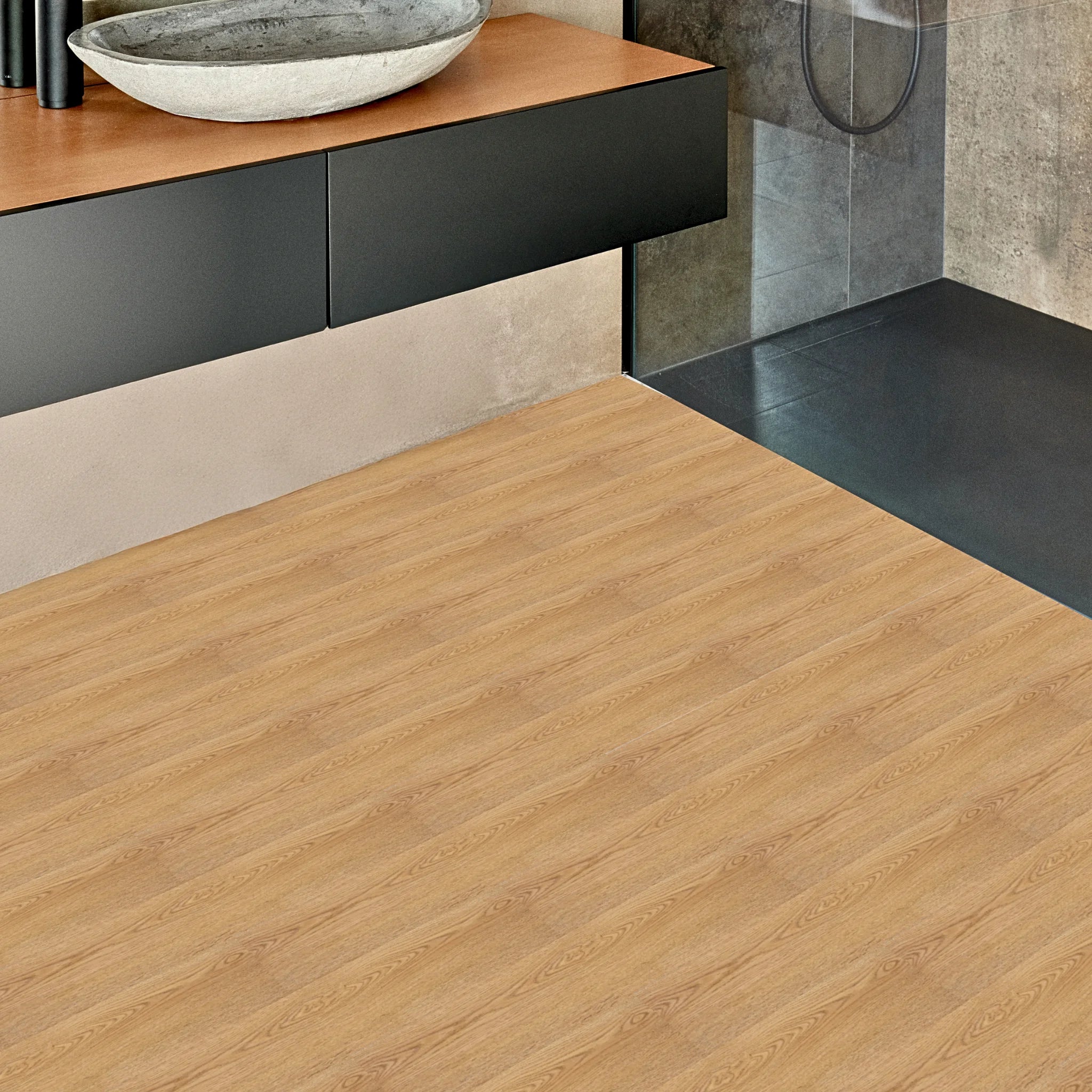 a bathroom with LVT flooring grey wood effect