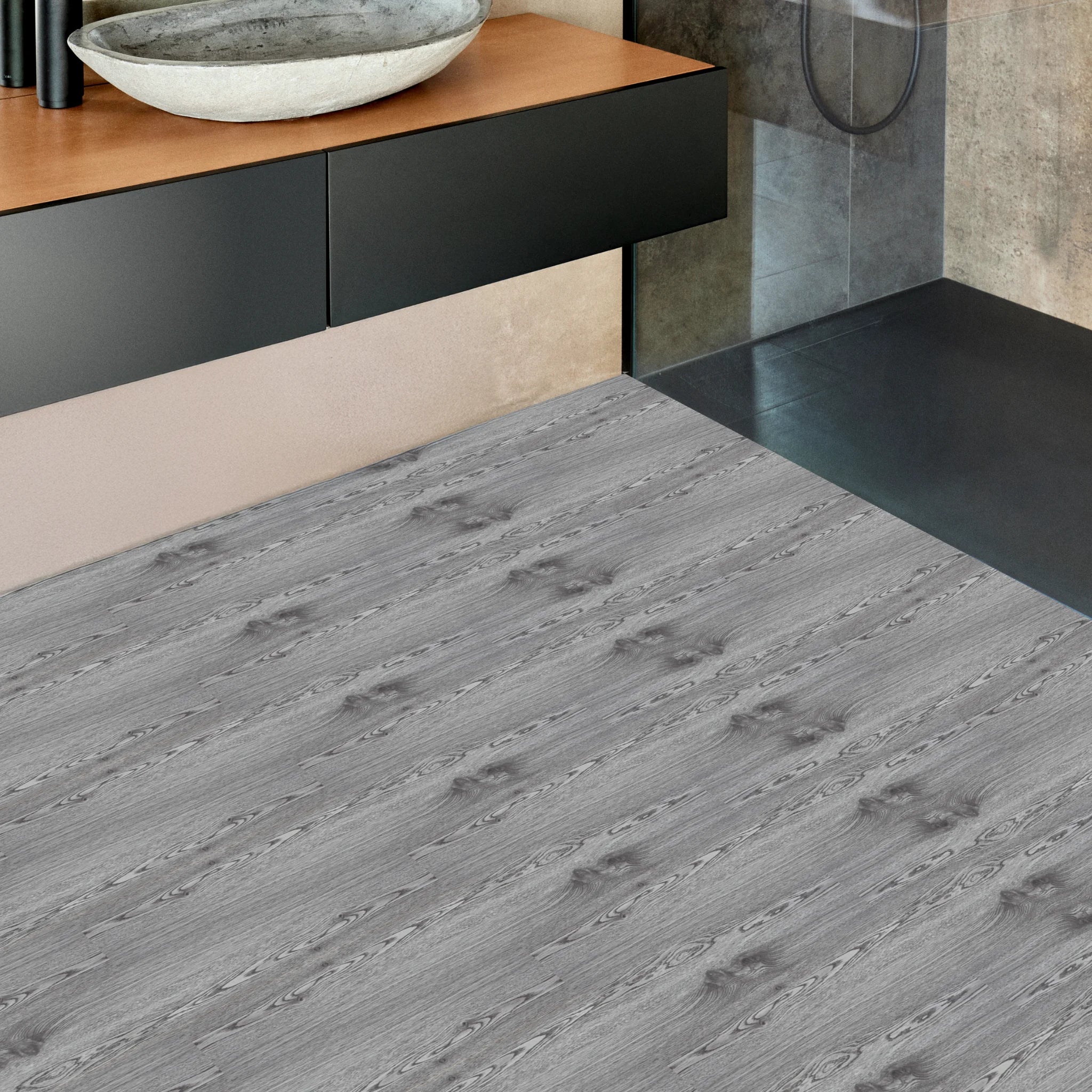 a bathroom with LVT flooring brown wood effect