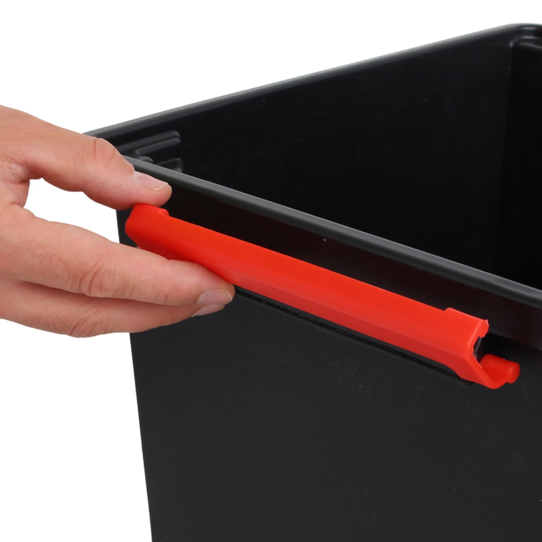 close-up of red clip lock handle on storage box
