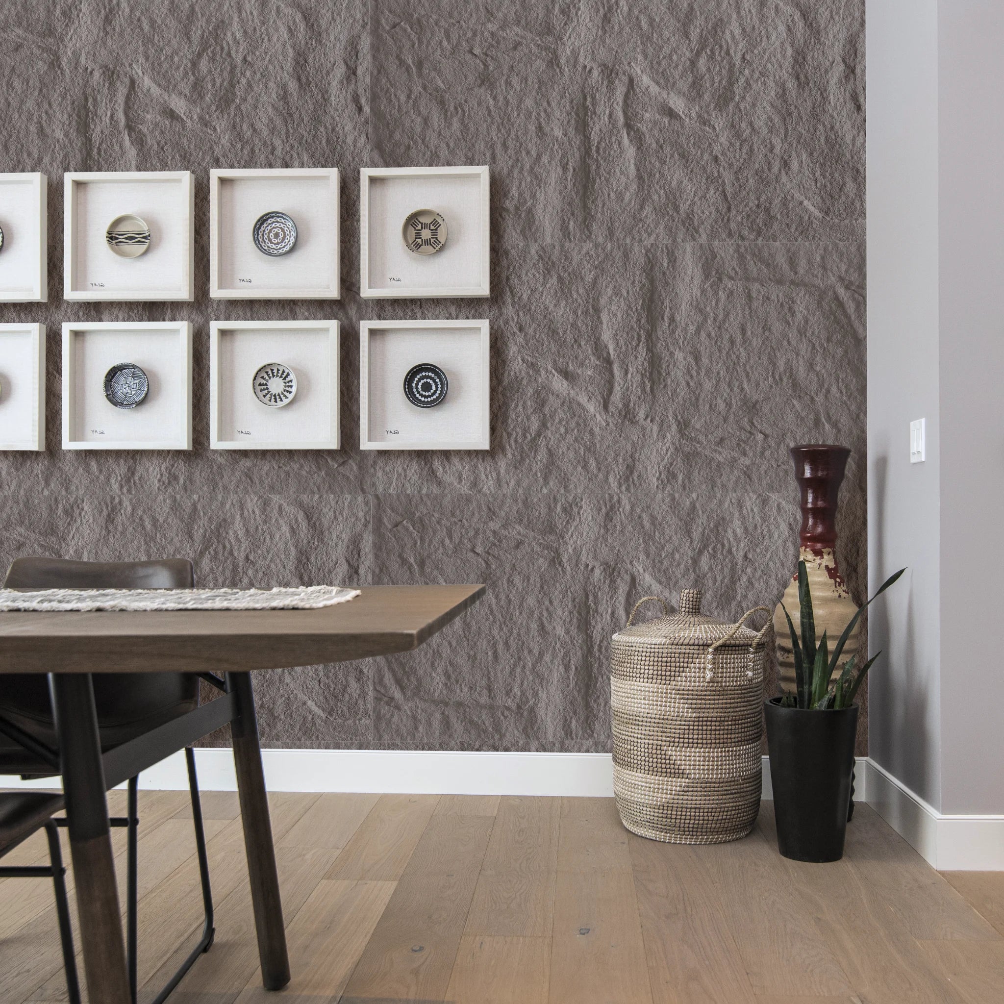 Dining room with decorative faux stone wall panels in taupe grey for modern interior wall design