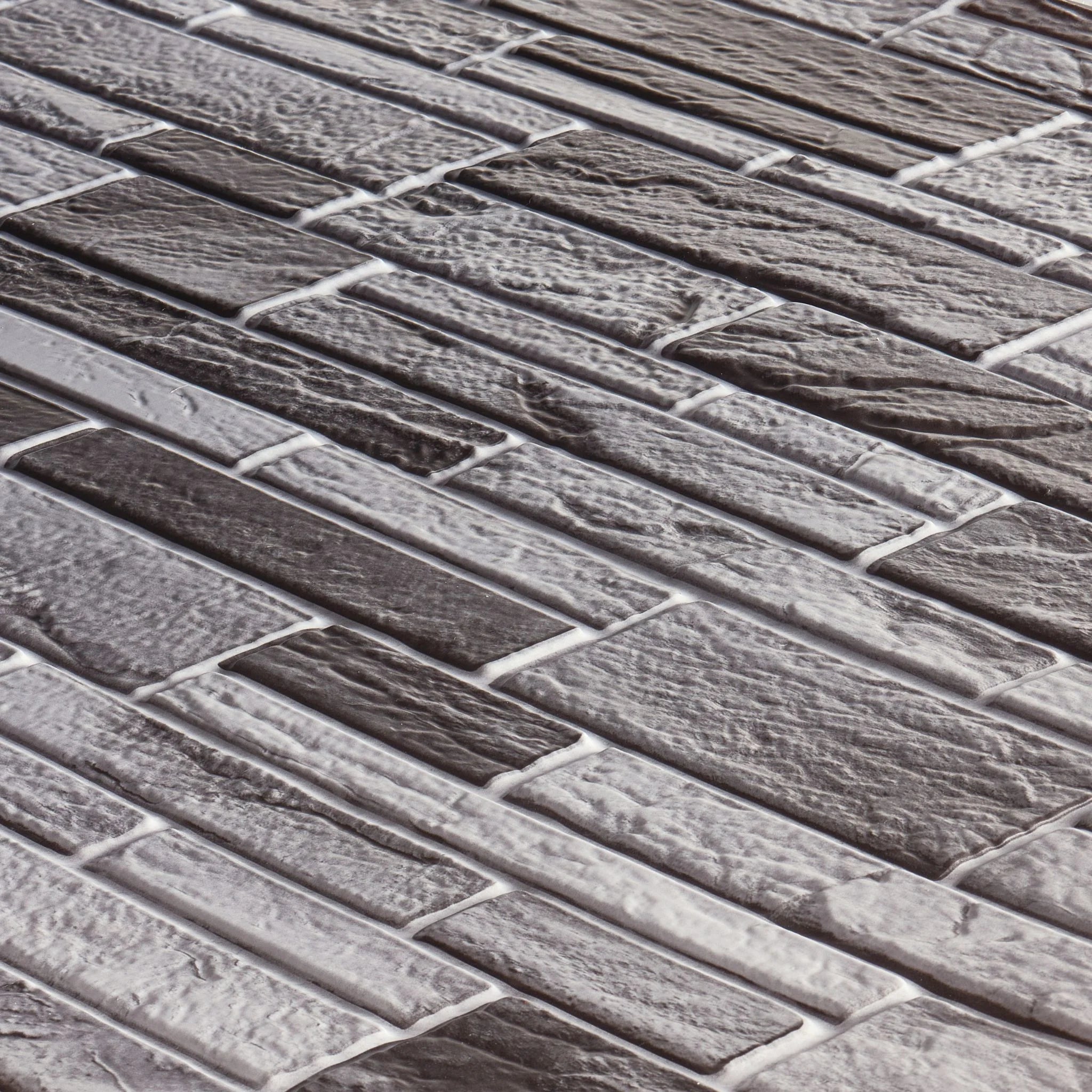 angled view of light grey slim stone brick pattern 3d wall panel