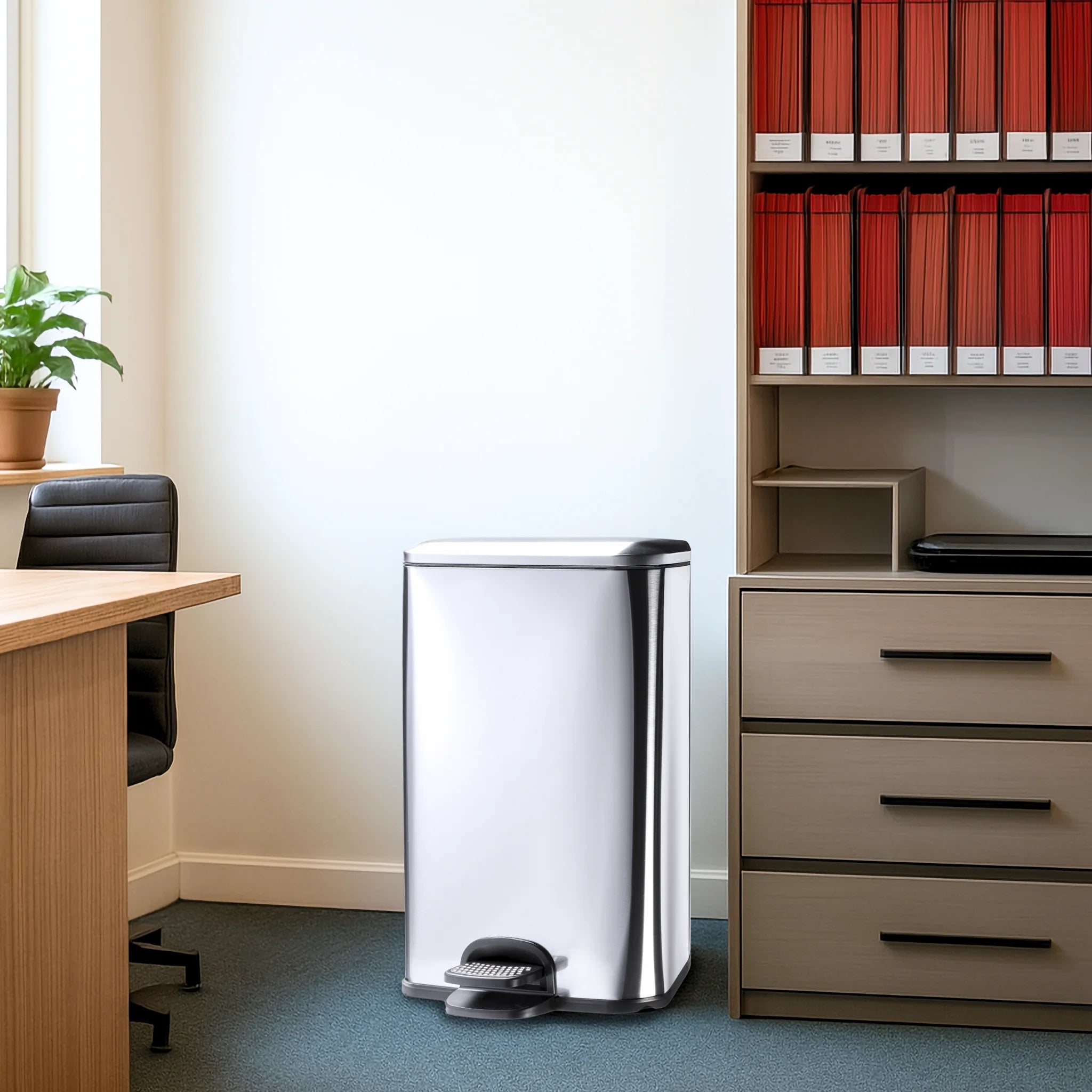 A stainless steel rubbish bin in an office showcasing a sleek design for contemporary workspaces