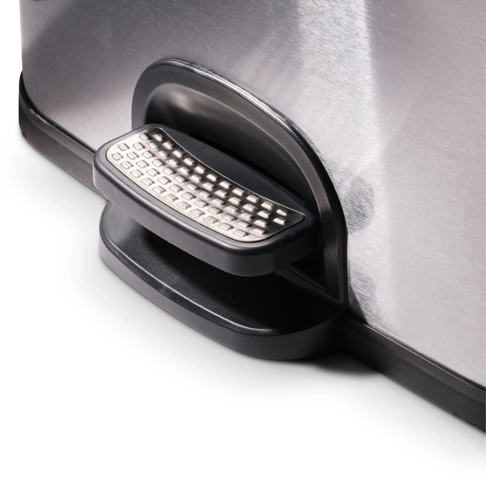 Close-up of foot pedal on stainless steel kitchen bin part of modern kitchen bins range