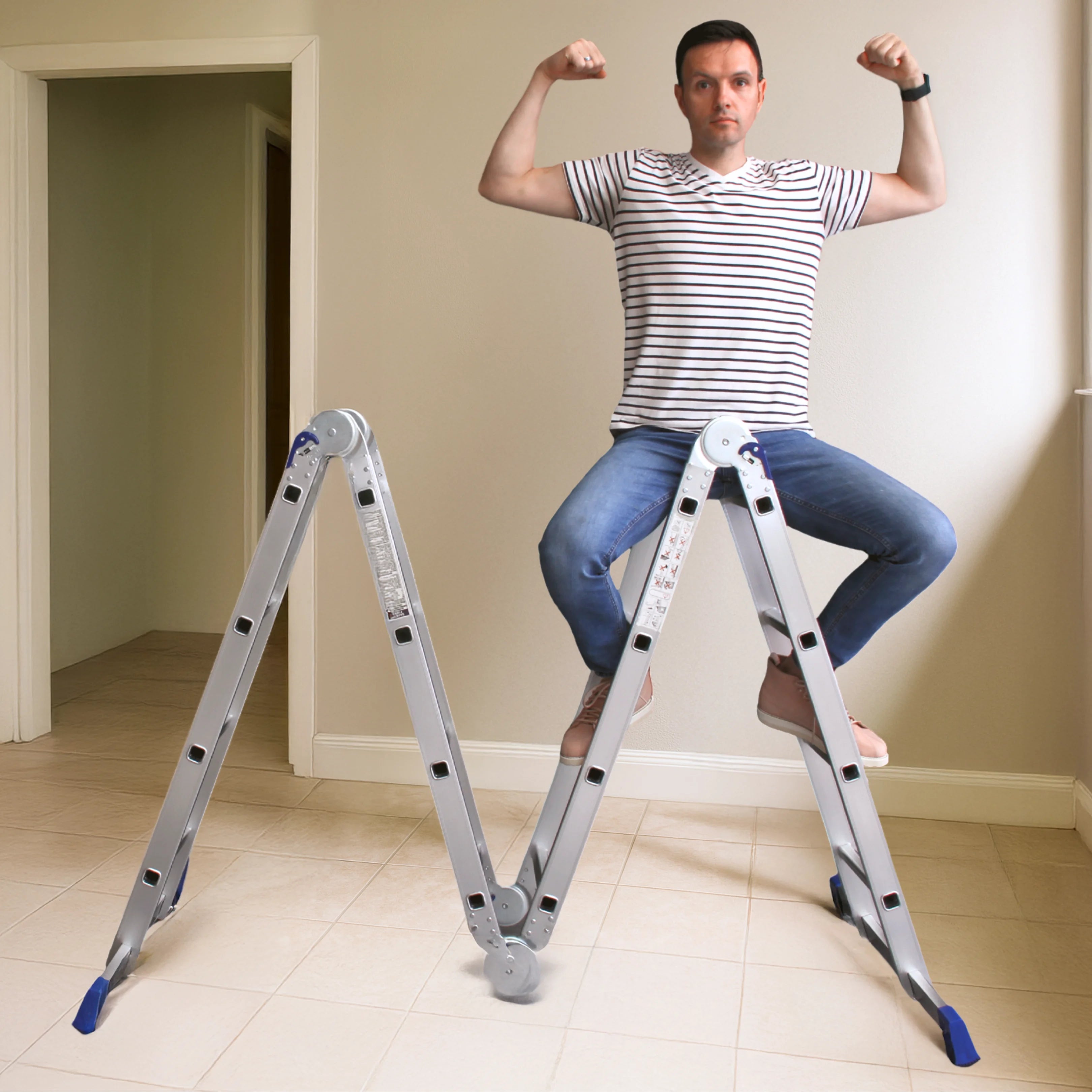 A man on a lightweight unfolded16-step ladder sits in livingroom