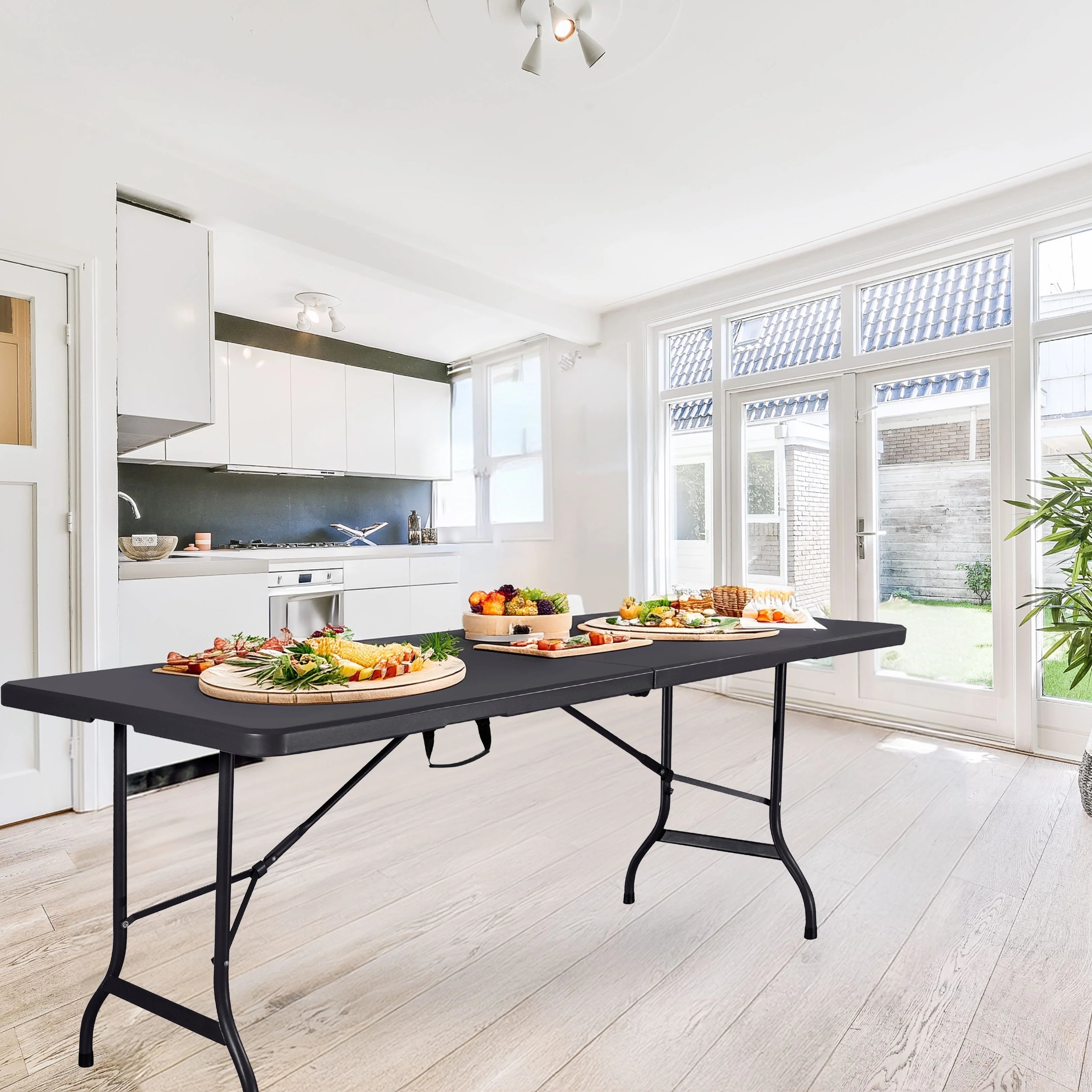 black 6ft folding table with food in bright kitchen
