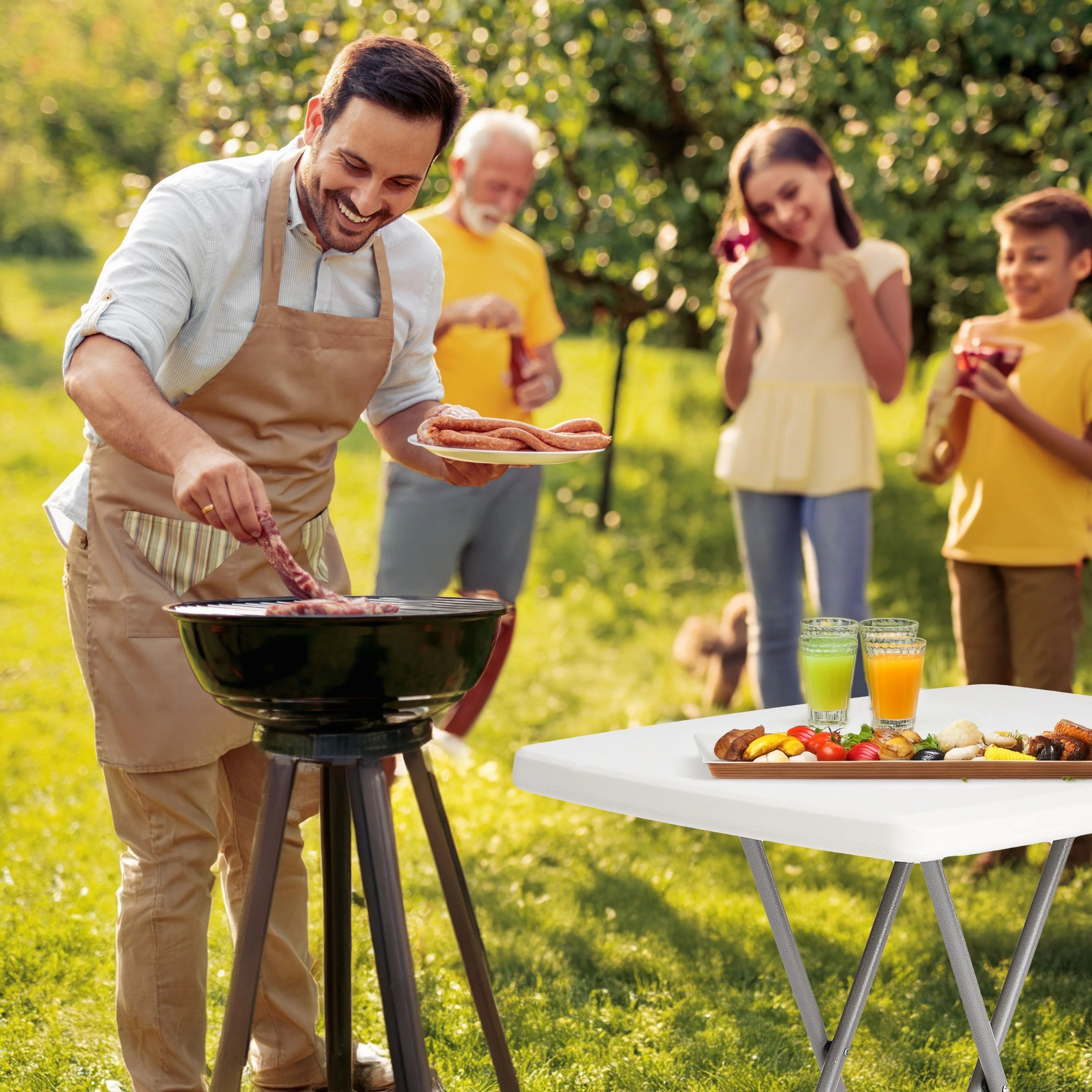 white folding table in use at outdoor barbecue