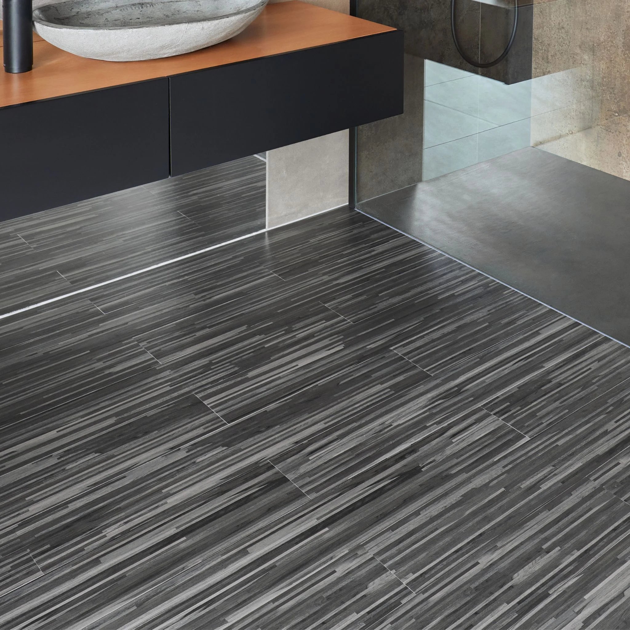 Dark grey vinyl wooden flooring in a modern bathroom setting