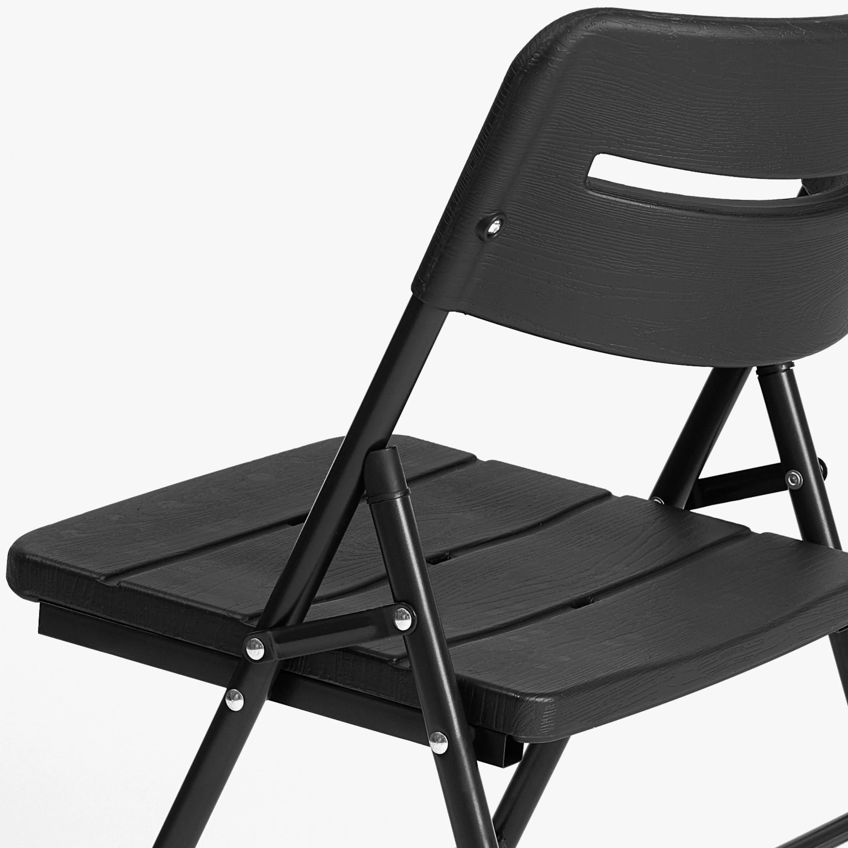 close up of black folding chair