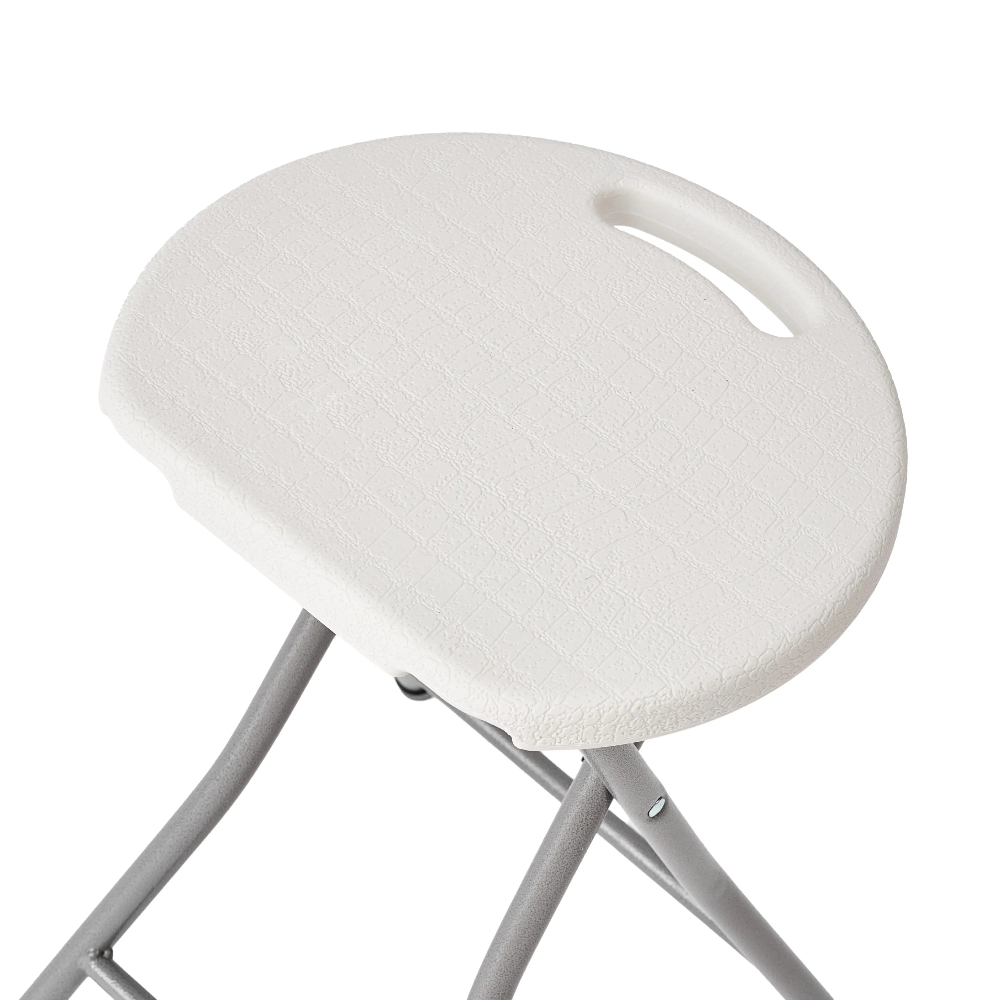 close up of white folding stool corner detail