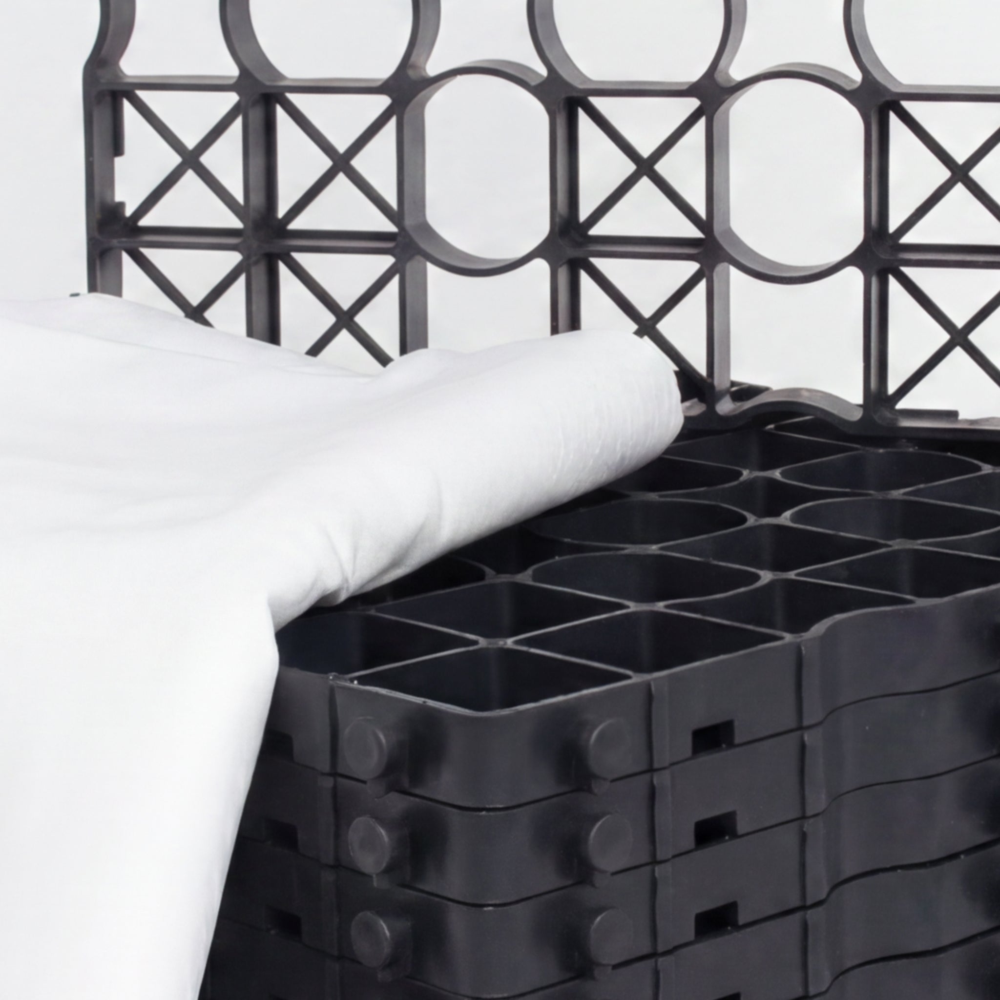 Folded white membrane on gravel grids