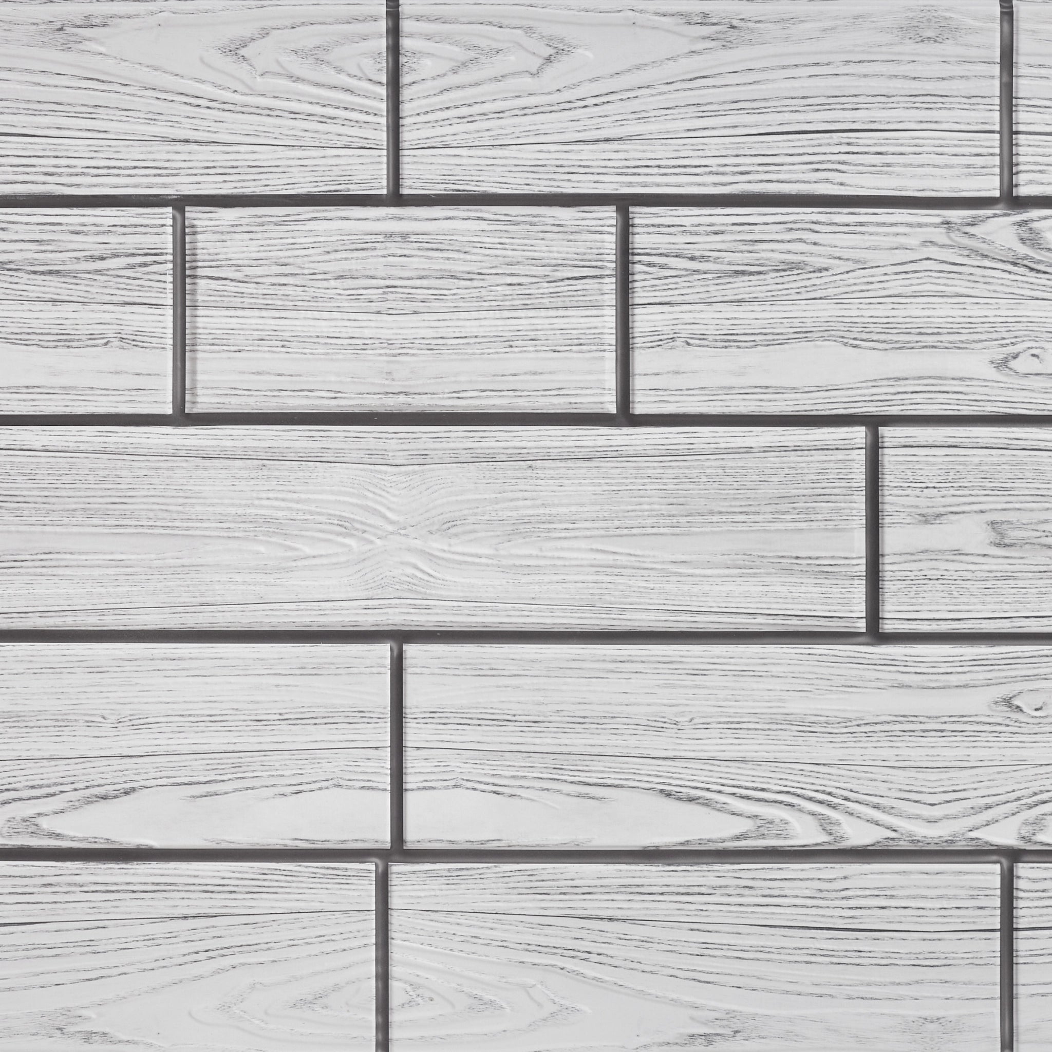 Grey wall panel with geometric patterns, close-up view