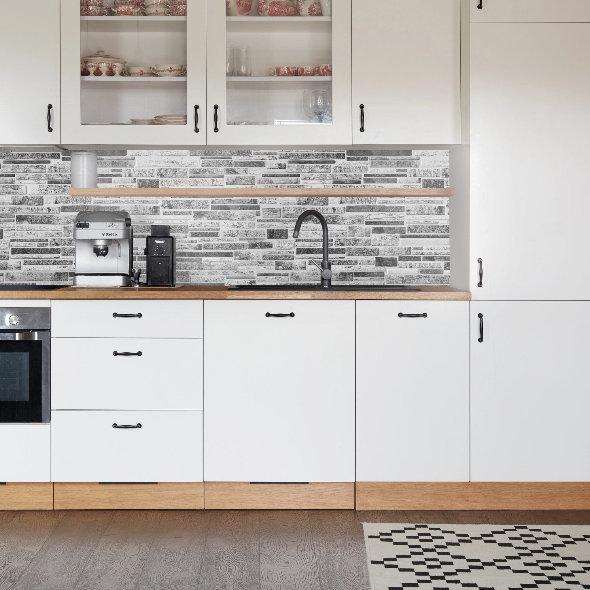 Kitchen with grey geometric-patterned wall panels and modern decor