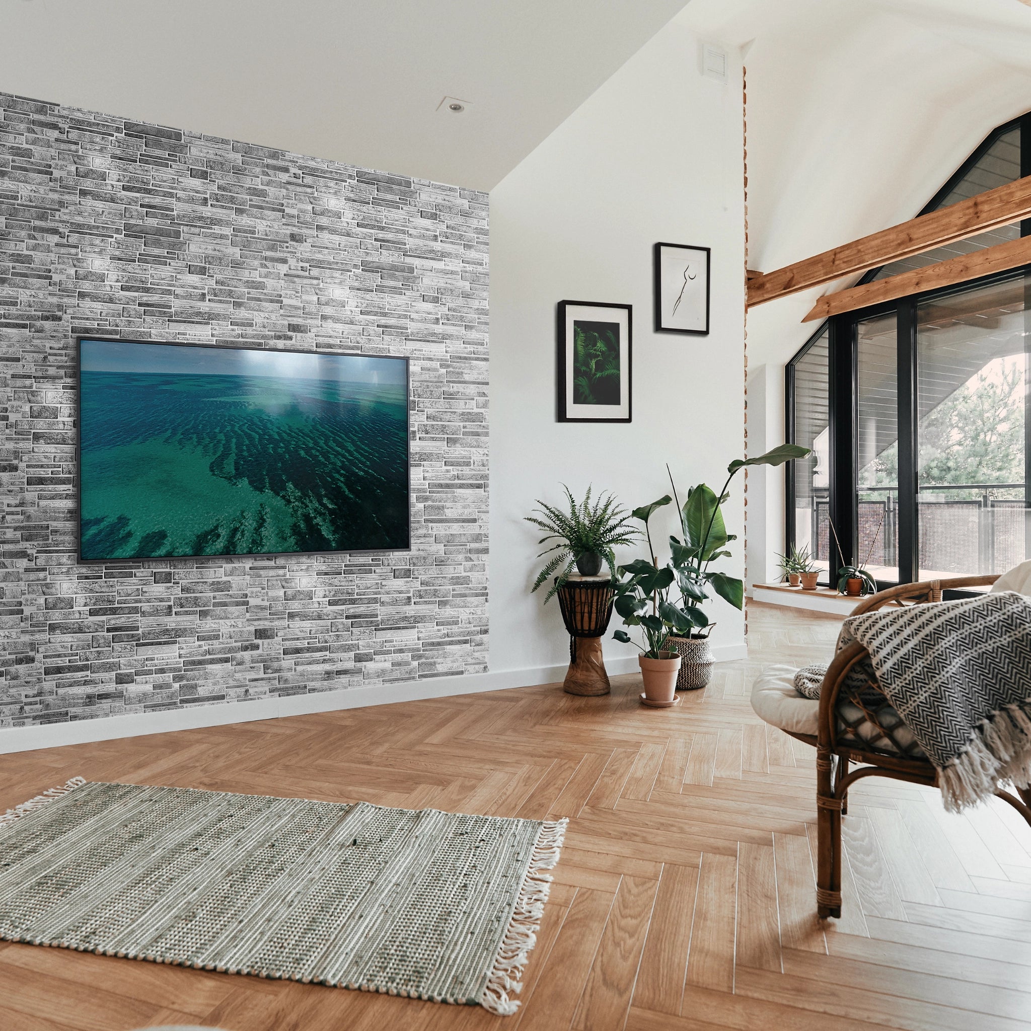 Modern living room with grey wall panel featuring geometric patterns