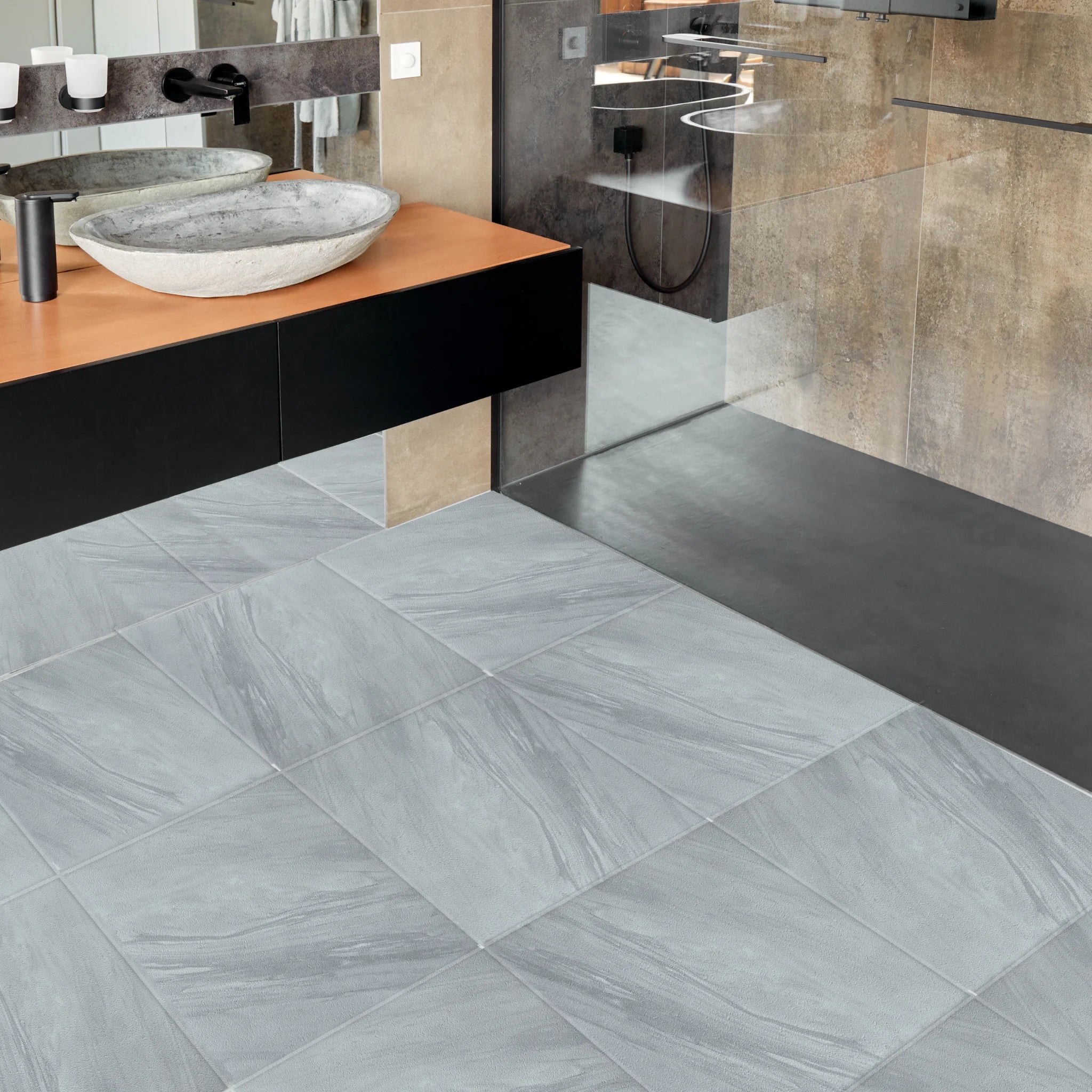 cozy bathroom with large square grey white marble tile flooring
