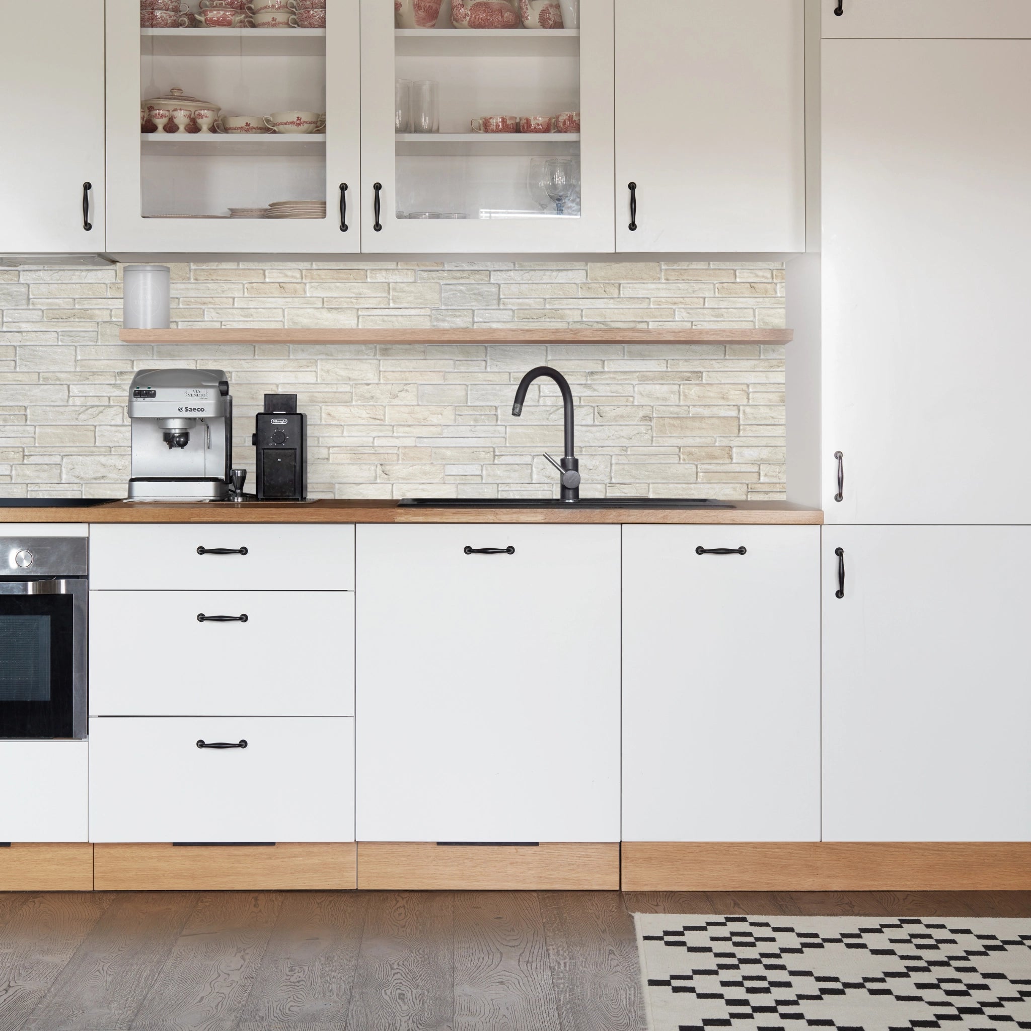 Kitchen with mix of beige, & white geometric-patterned wall panels and modern decor