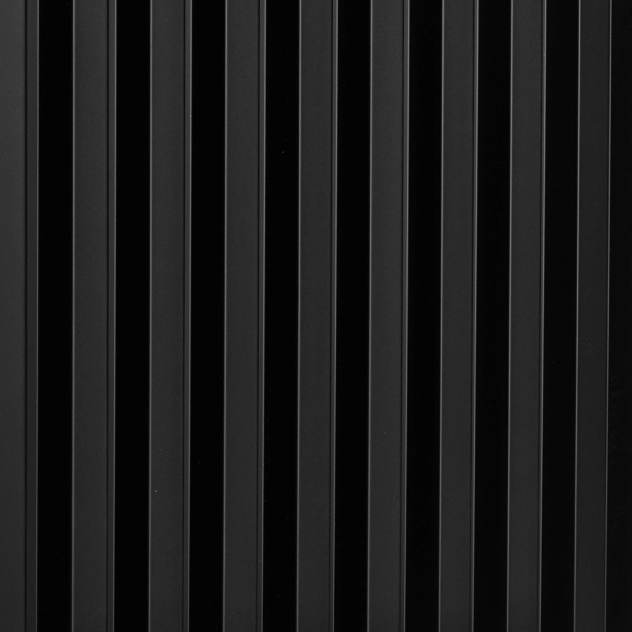 Close-up of black PVC wall panel with vertical ribbed pattern