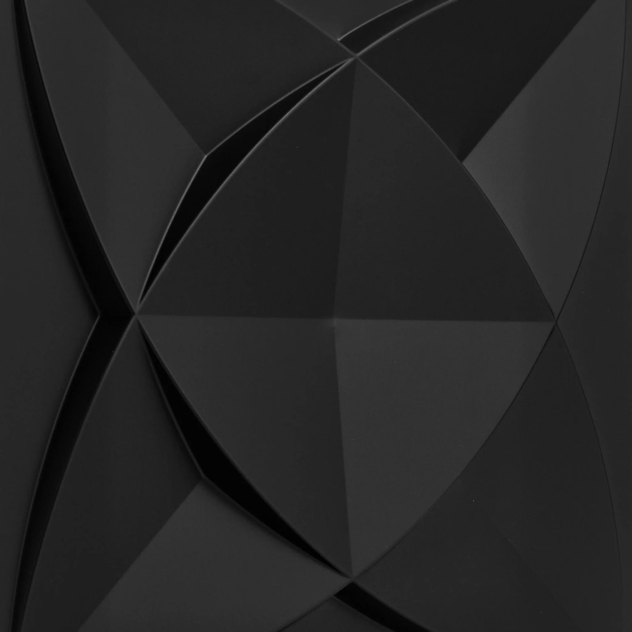 Close-up of black PVC wall panel with geometric designs
