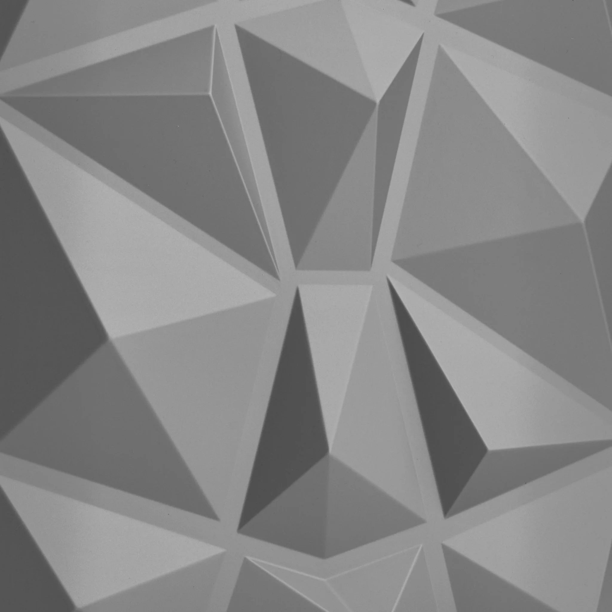 Close-up of silver PVC wall panel with diamond designs