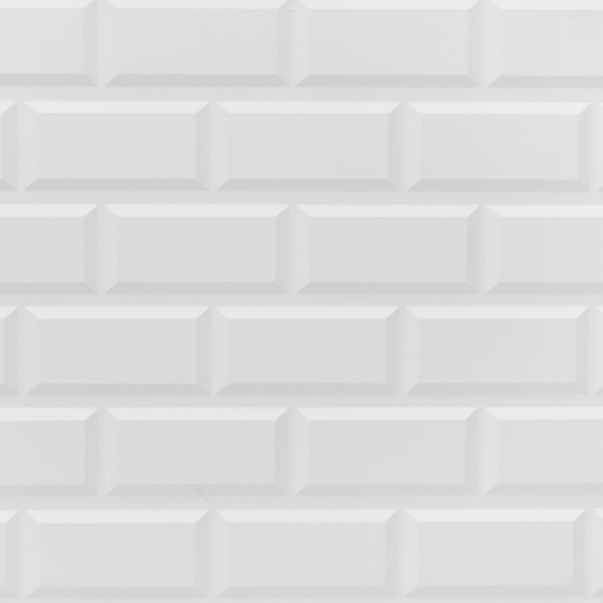 Close-up of white wall panel with geometric designs