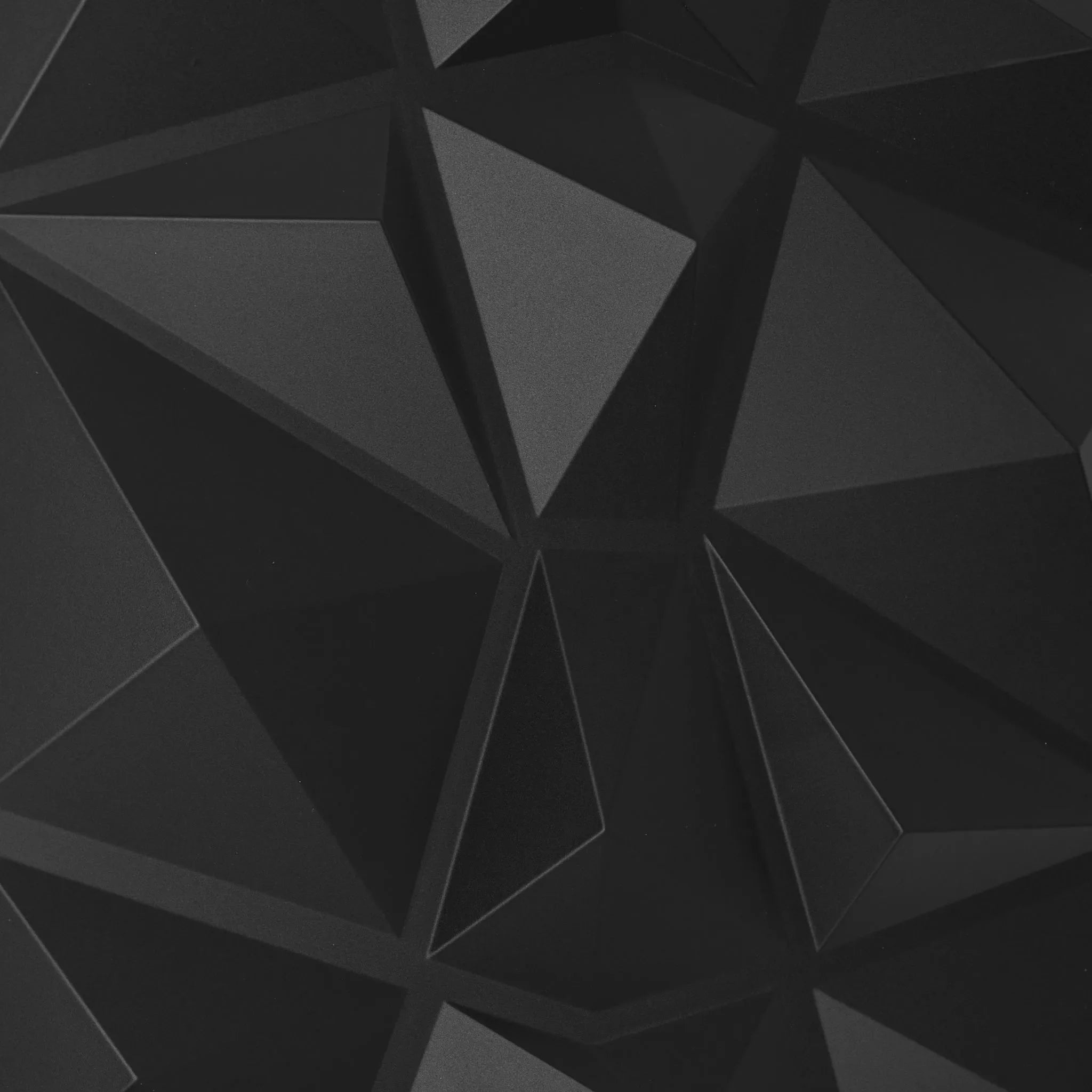 "Close-up of black PVC wall panel with geometric design "