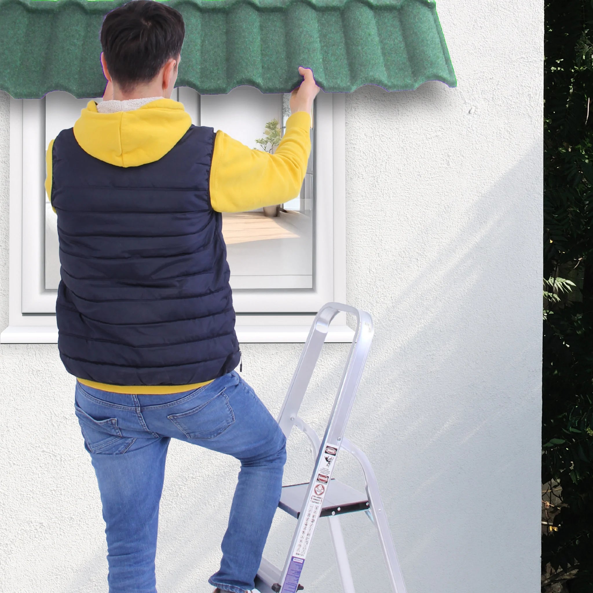 a man stands on a ladder, demonstrating corrugated roof tile application
