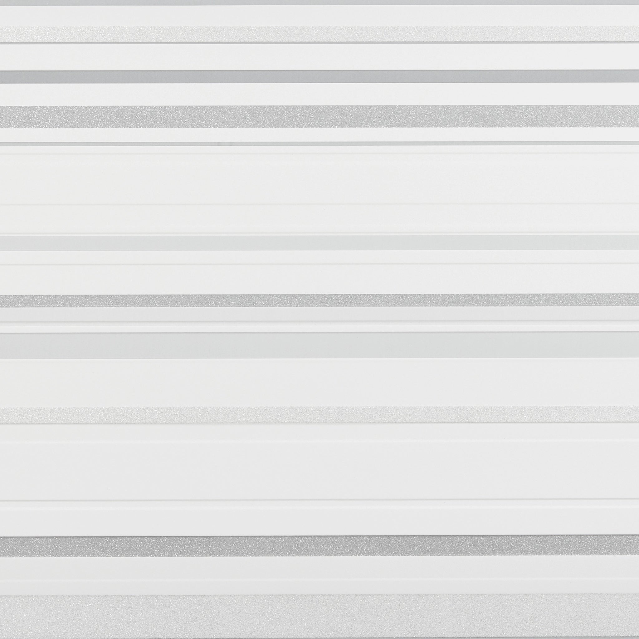 Close-up of white wall panel with geometric designs