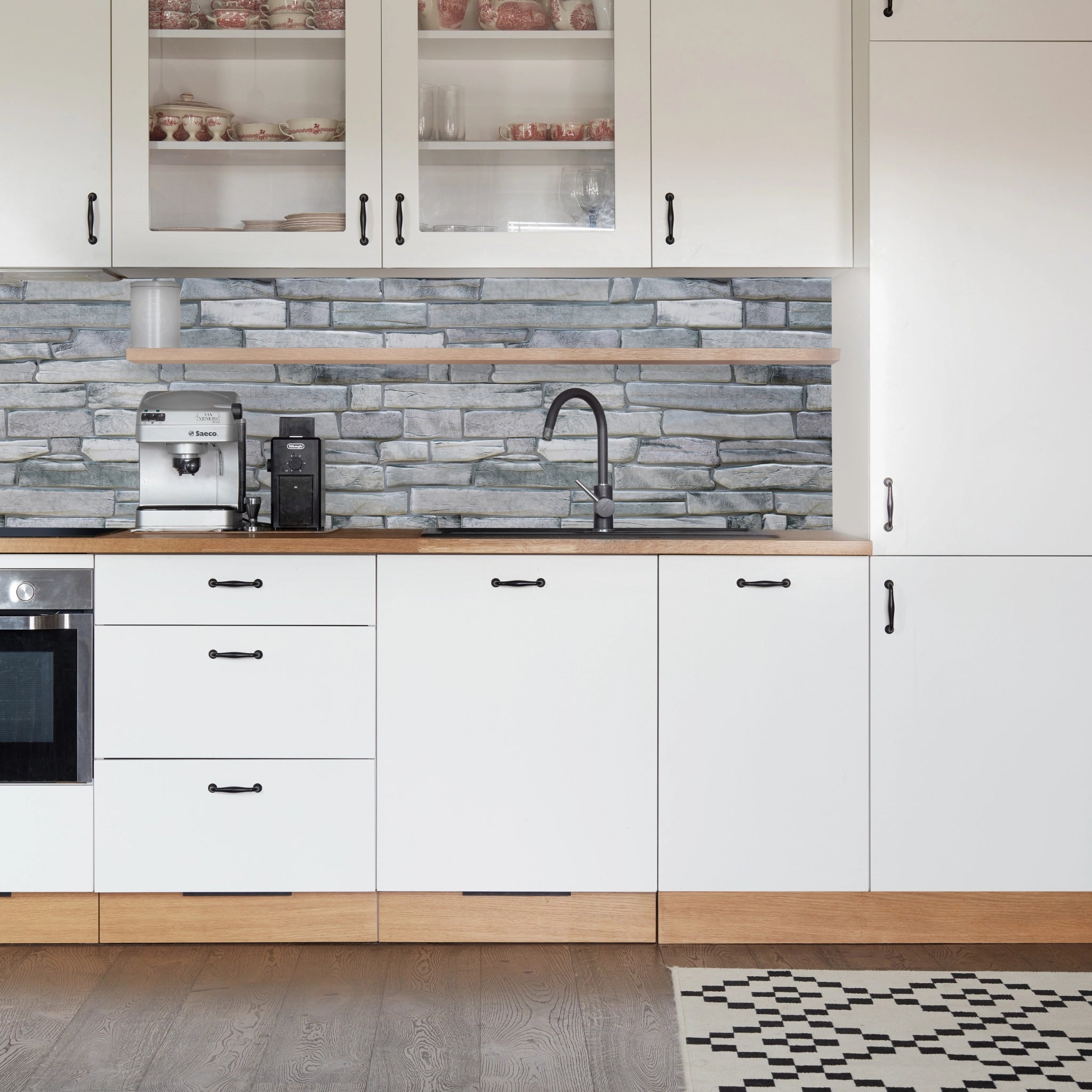 Kitchen with grey geometric-patterned wall panels and modern decor