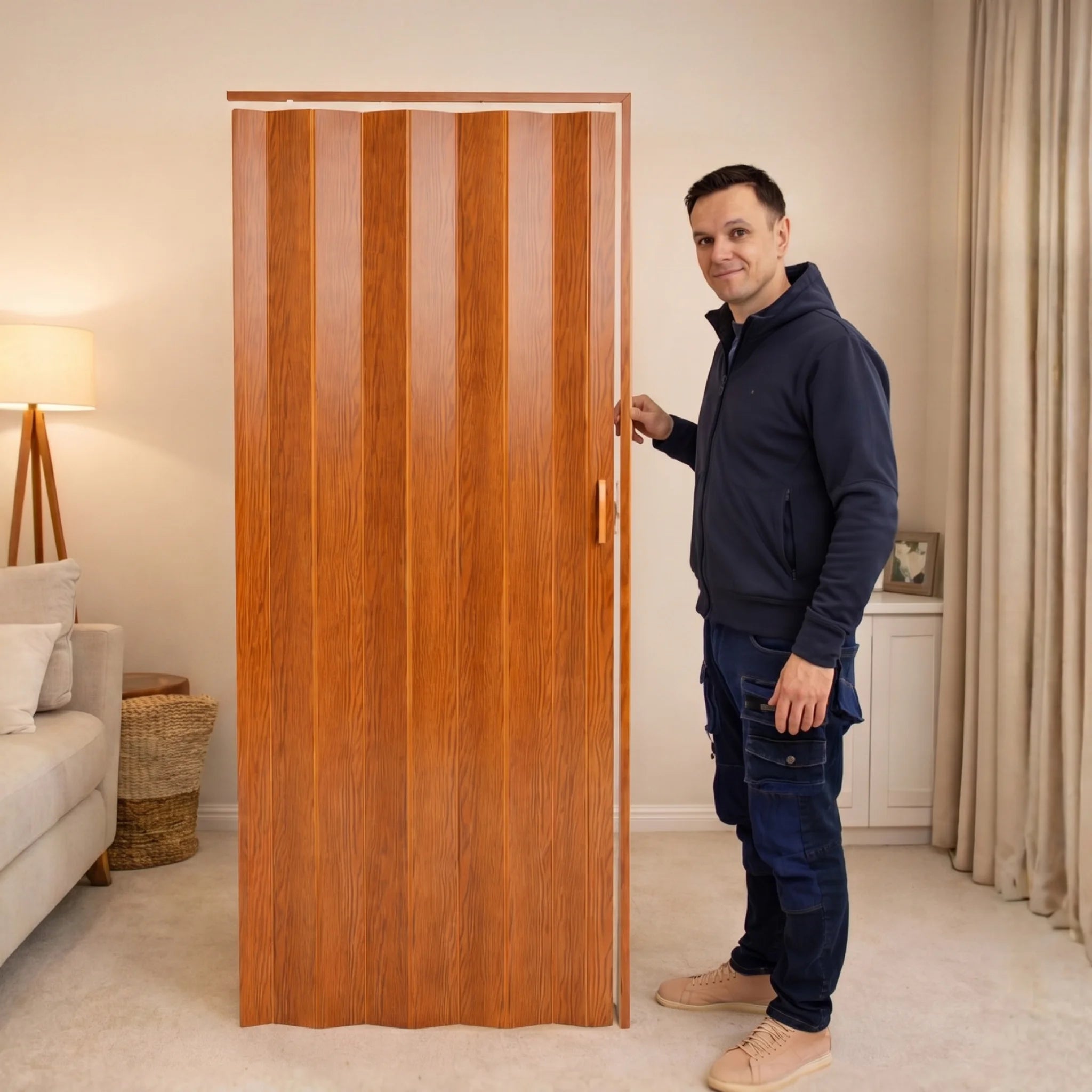 Man standing beside PVC folding door