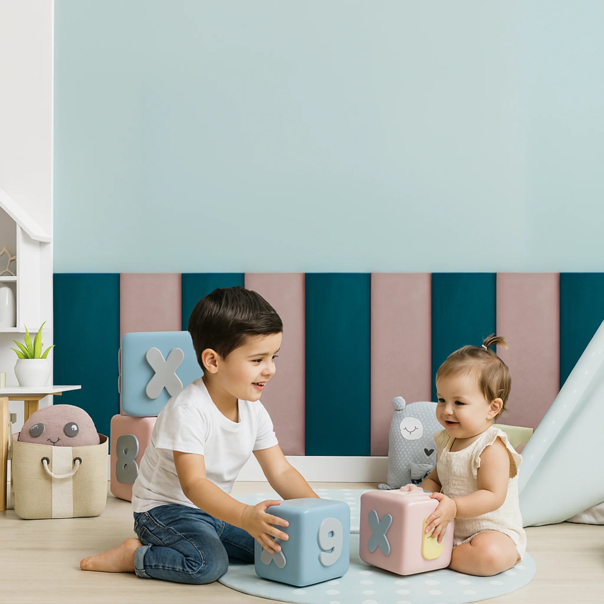Children play with blocks in a room featuring anti collision wall panels