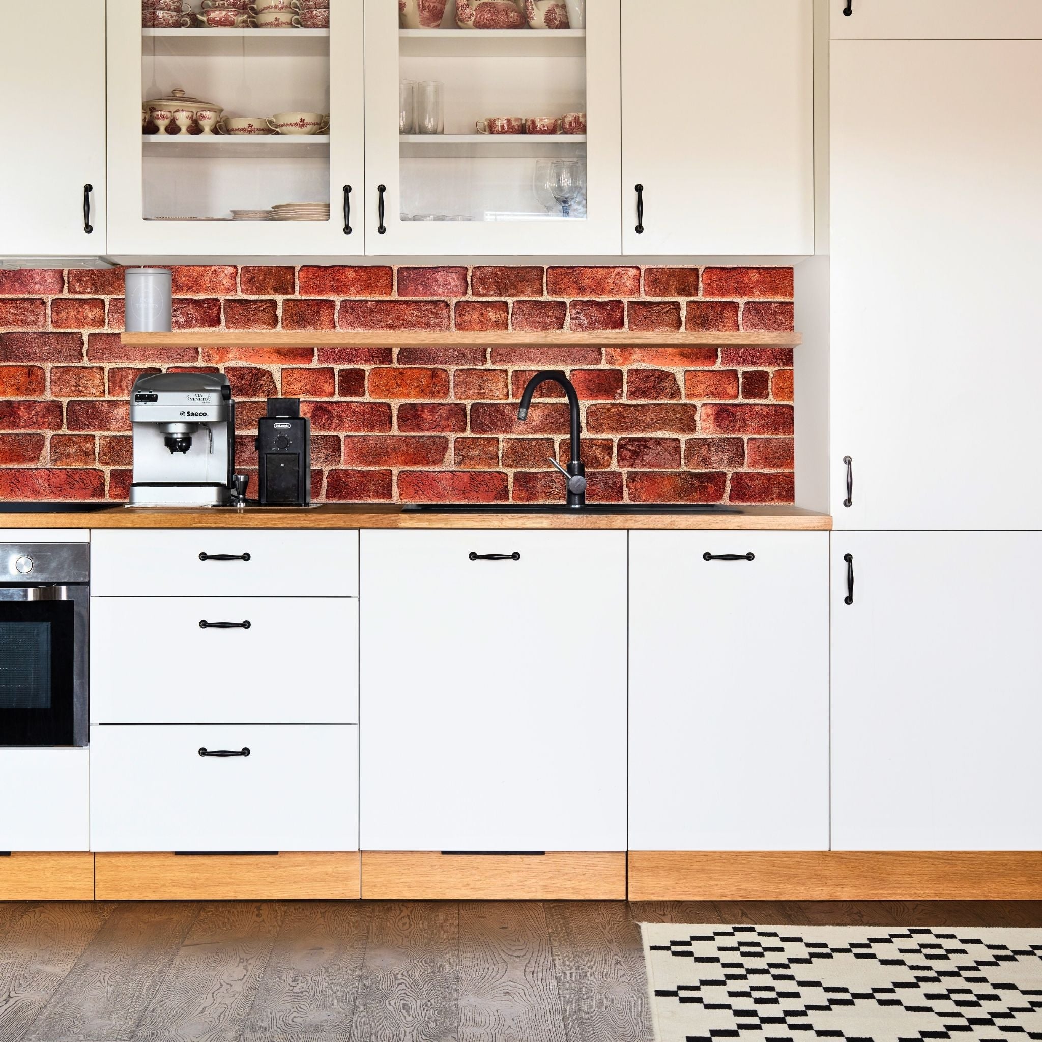 Kitchen with red geometric-patterned wall panels and modern decor