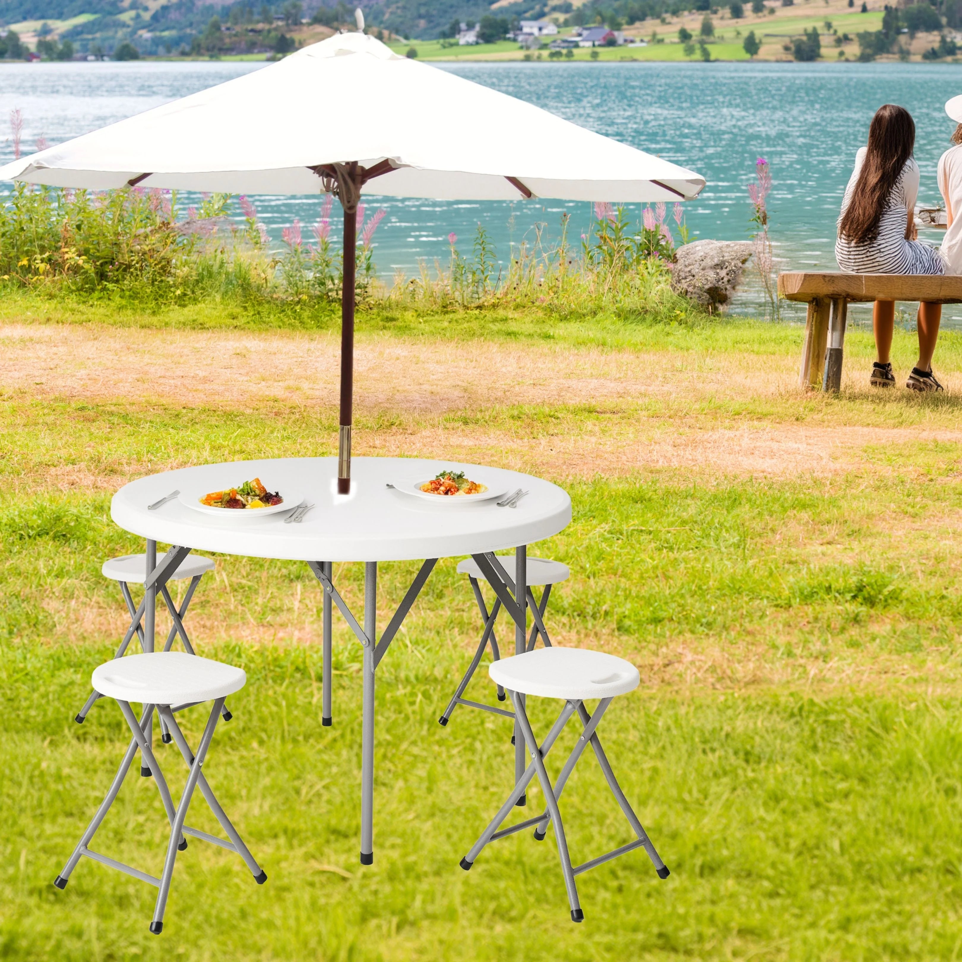 white round folding table in use at outdoor picnic