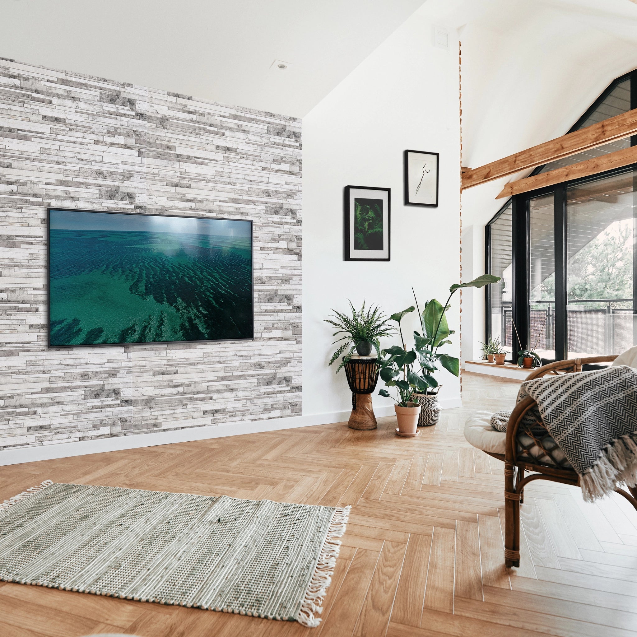 Modern living room with grey wall panel featuring geometric patterns