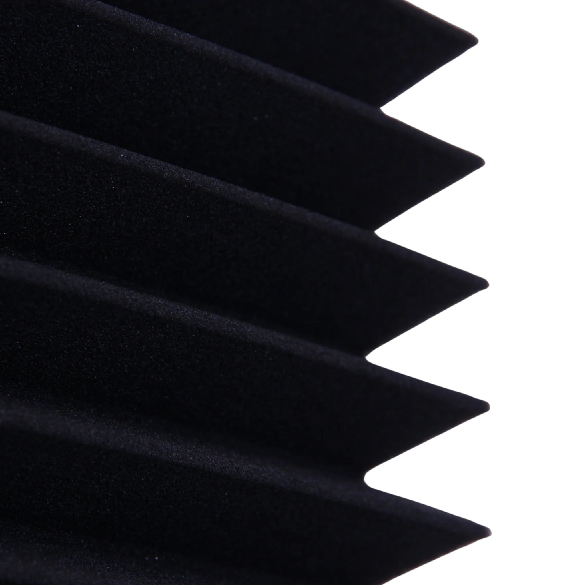 A close-up of a black triangular foam panel non-toxic material