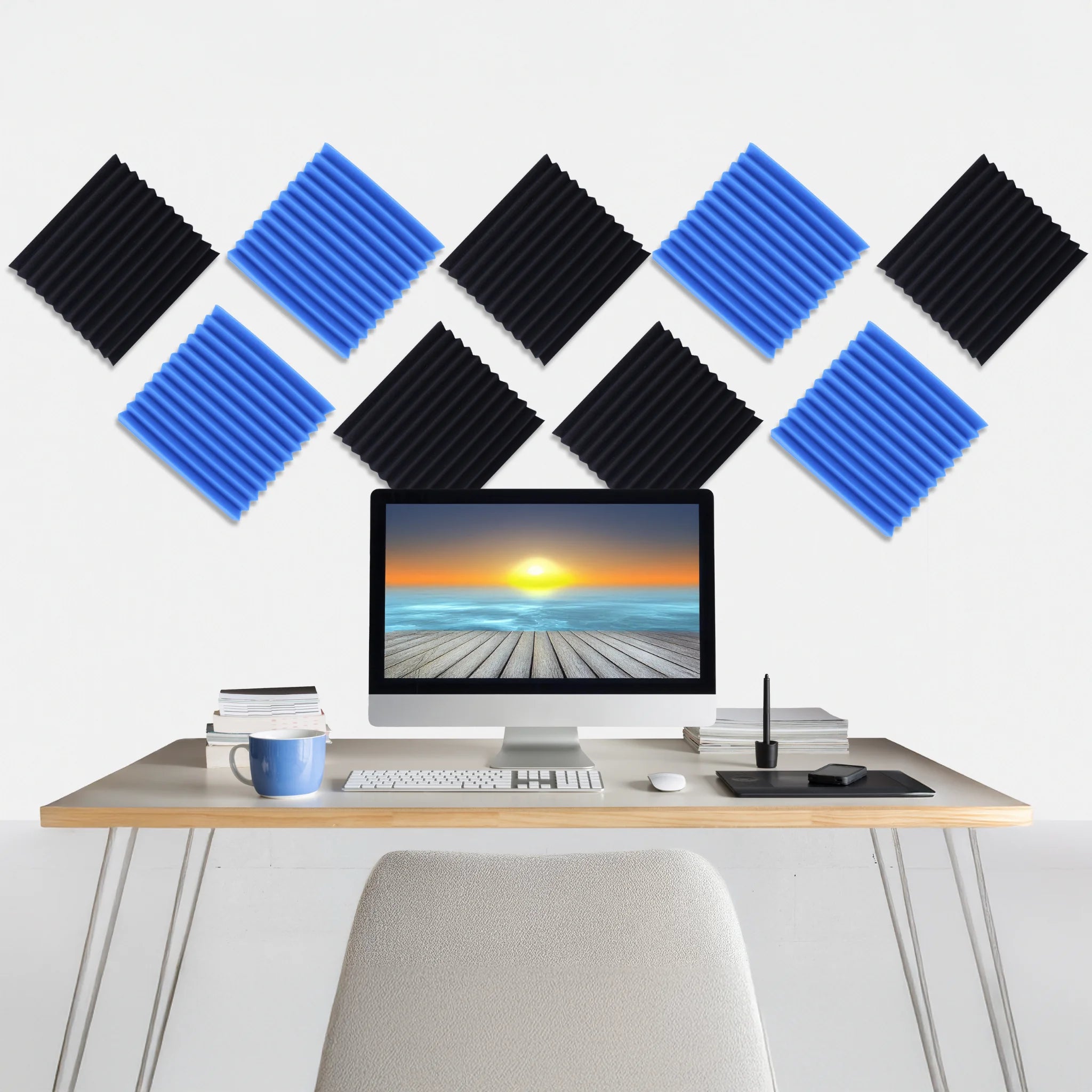 A workspace enhanced by a blue, black acoustic panel for improved sound quality
