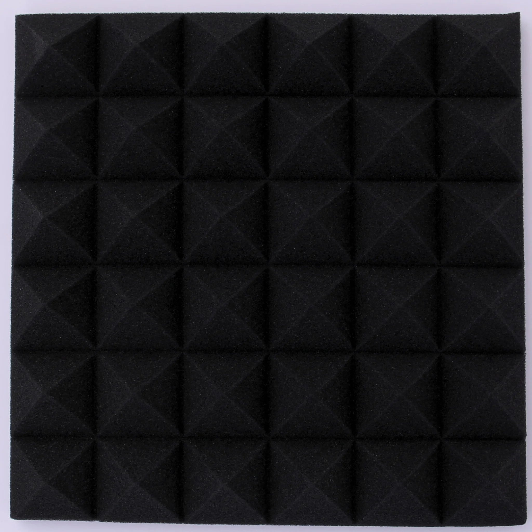 black pyramid shaped acoustic foam panel emphasizing its unique texture