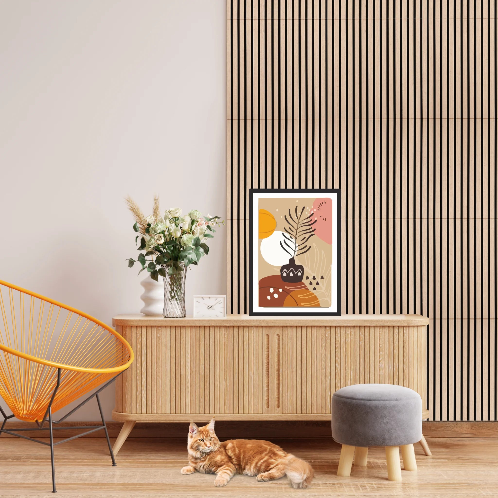 Acoustic wall panels in the background with a cat resting beside a wooden cabinet