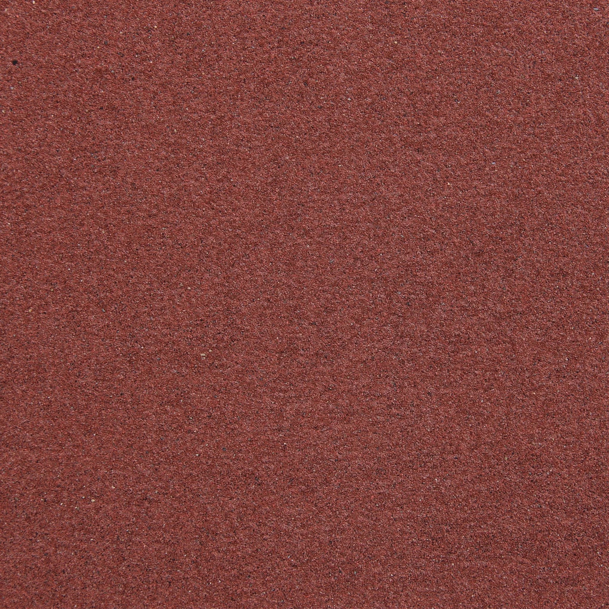 close-up of red roofing felt texture mineral finish