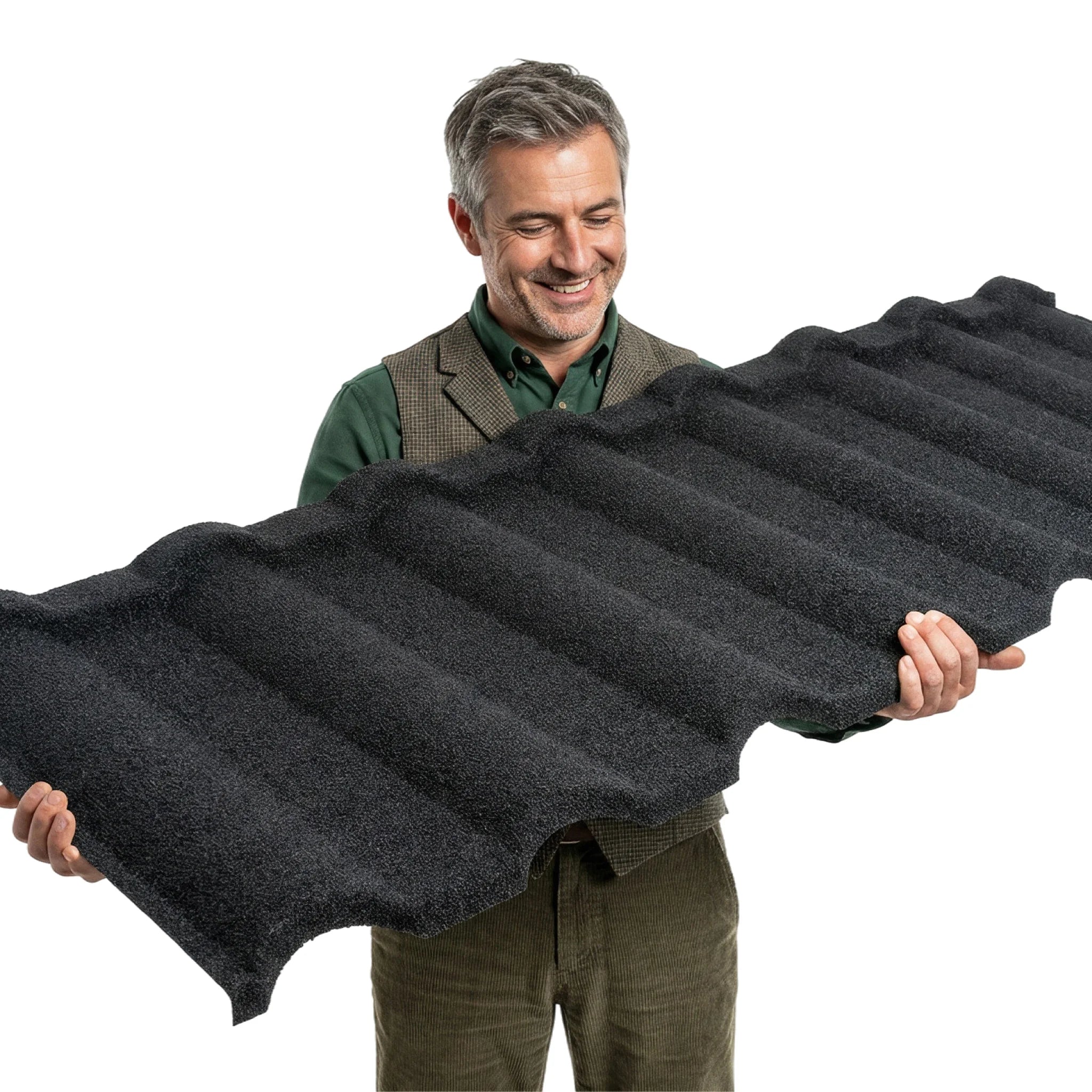 Man holding green metal roof shingle