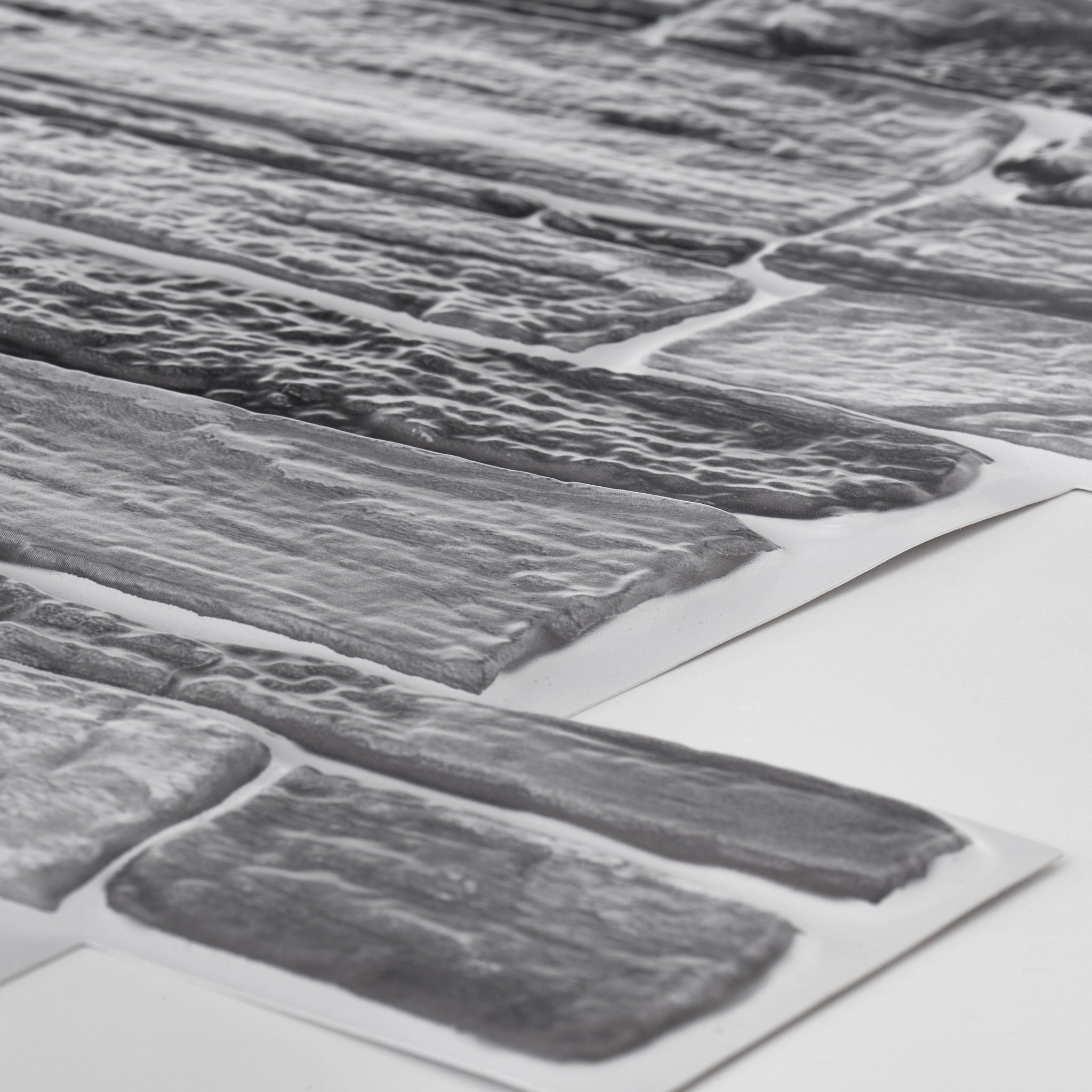 Closer look of the grey 3D wall panel