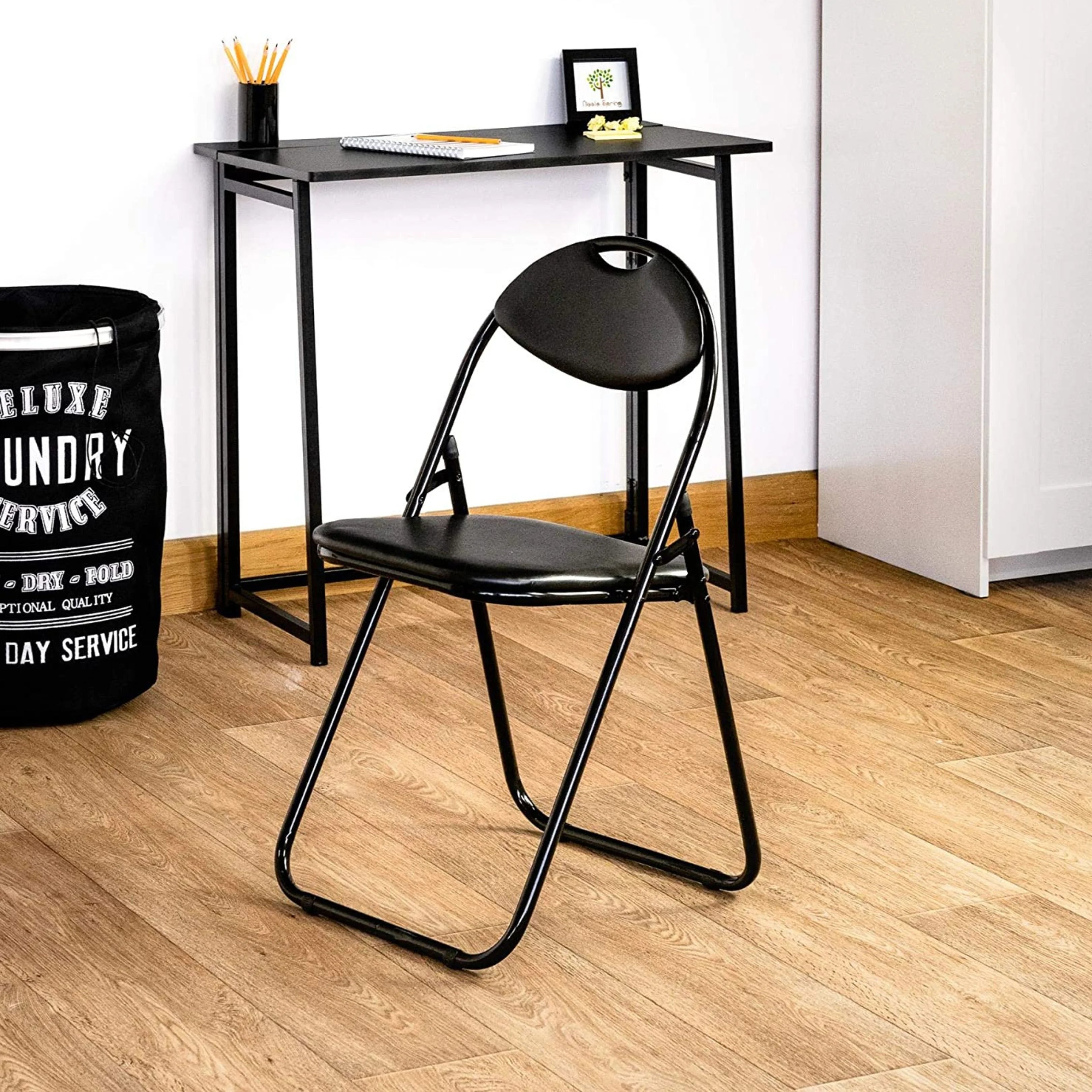 black folding chair in modern workspace setup