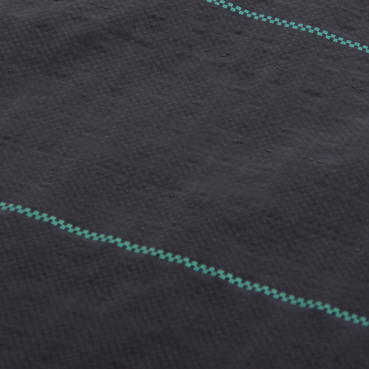 close-up woven weed barrier fabric with guide lines