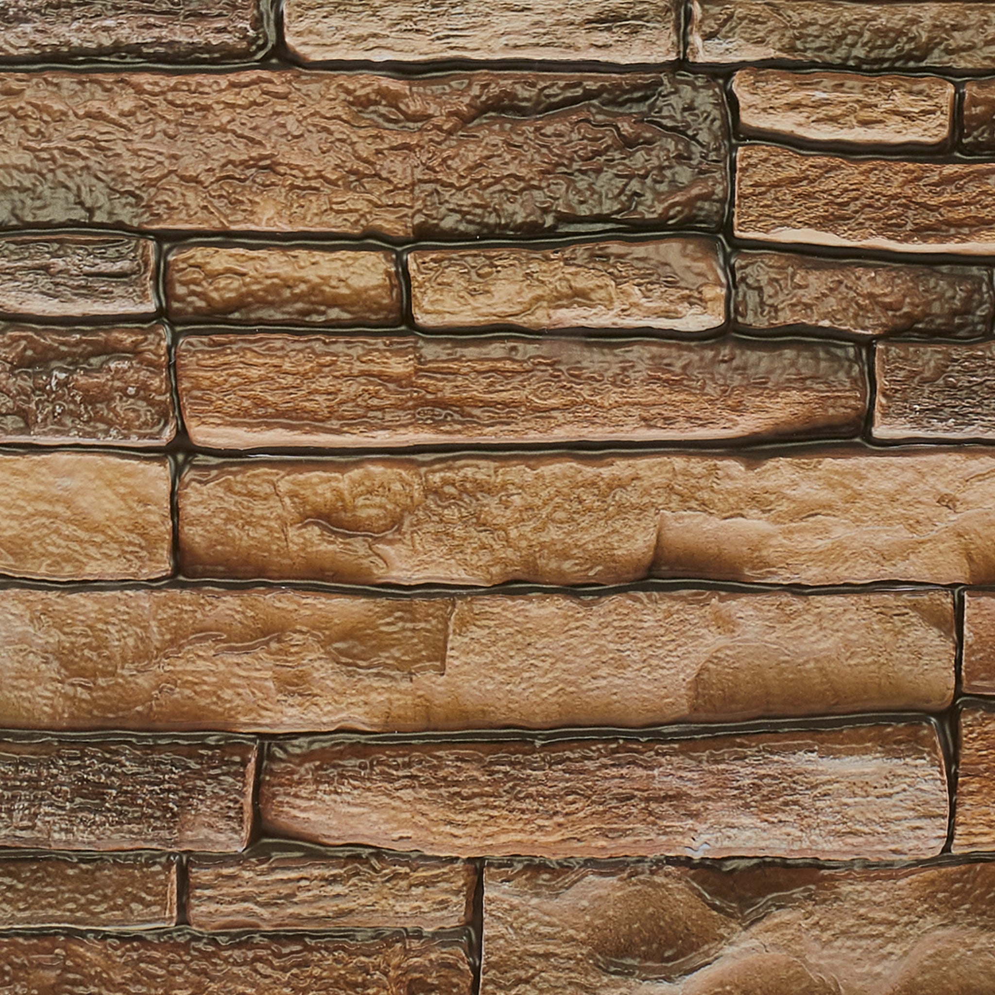 Close-up of rustic tan wall panel with geometric designs