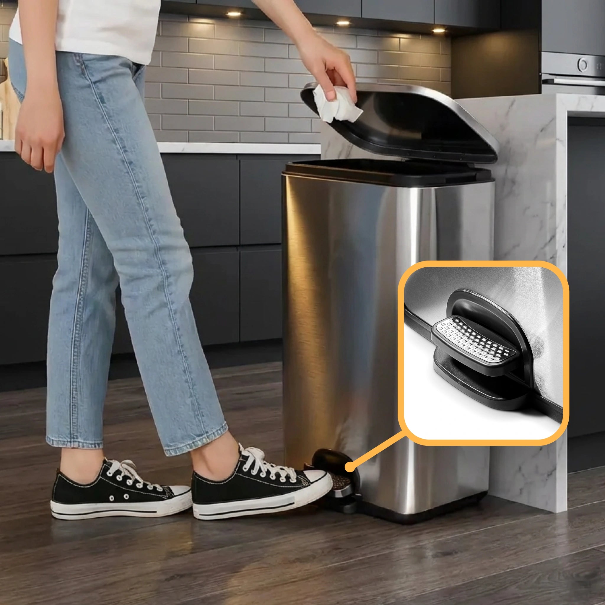 A woman positions a 50L kitchen bin with lid ready to dispose of waste