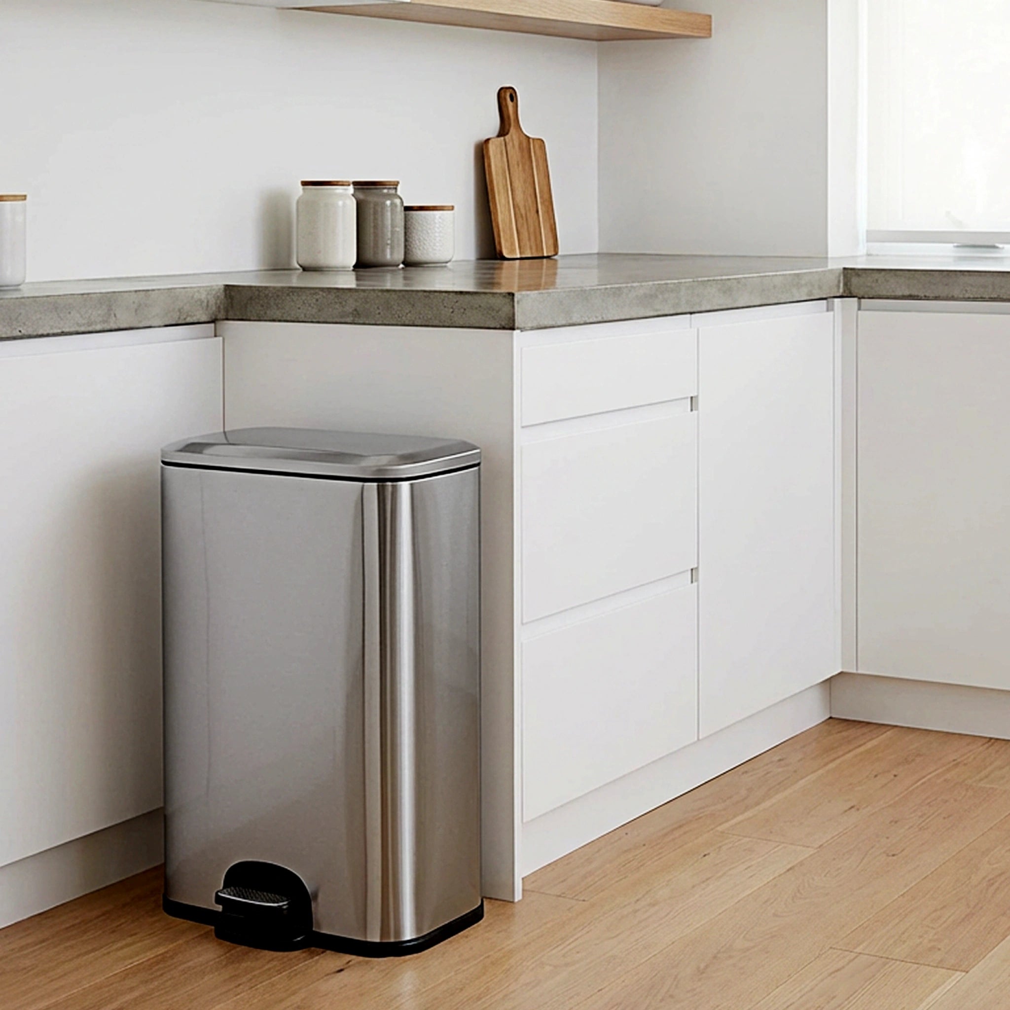A stainless steel rubbish bin in an office showcasing a sleek design for contemporary workspaces