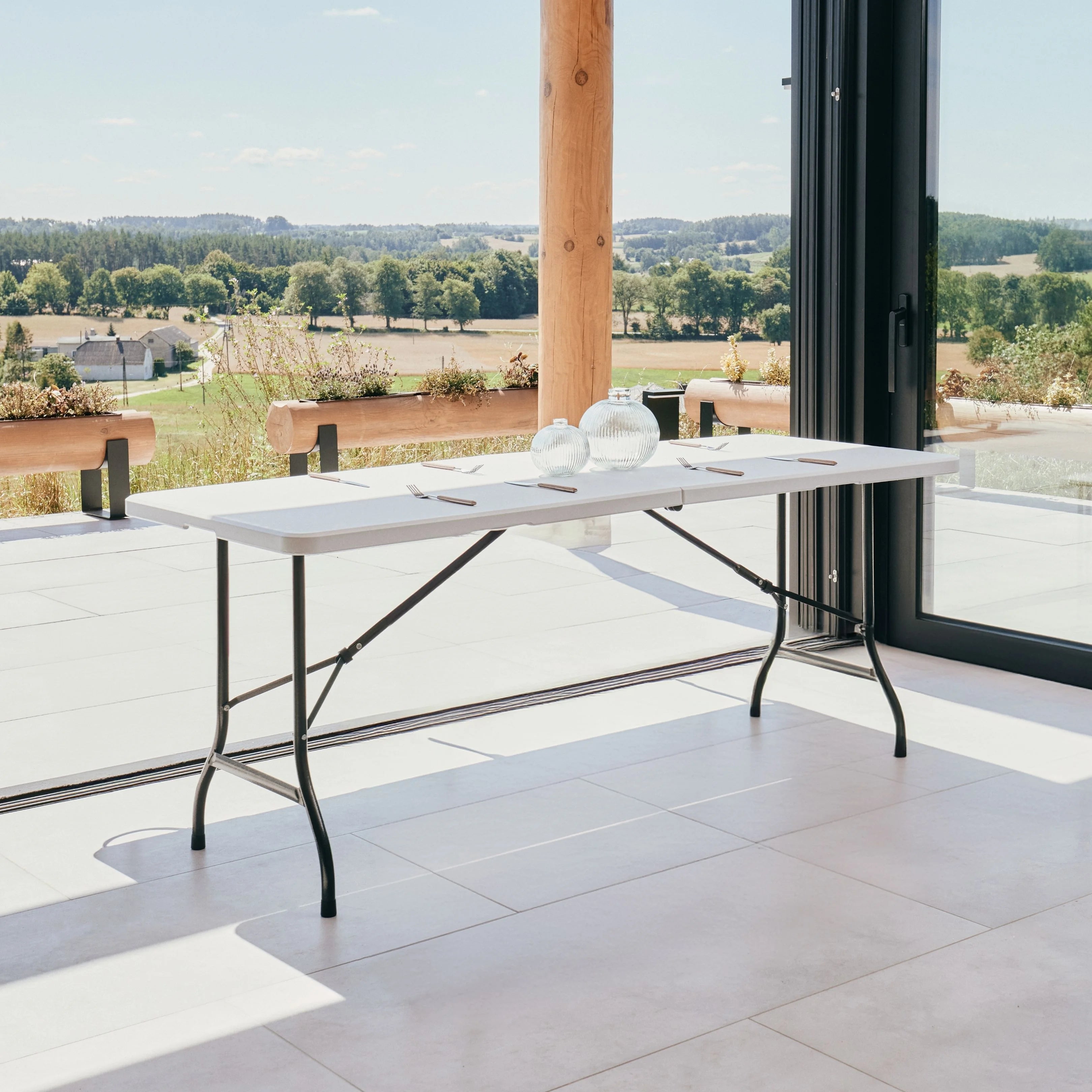 white 6ft folding table on patio with scenic view