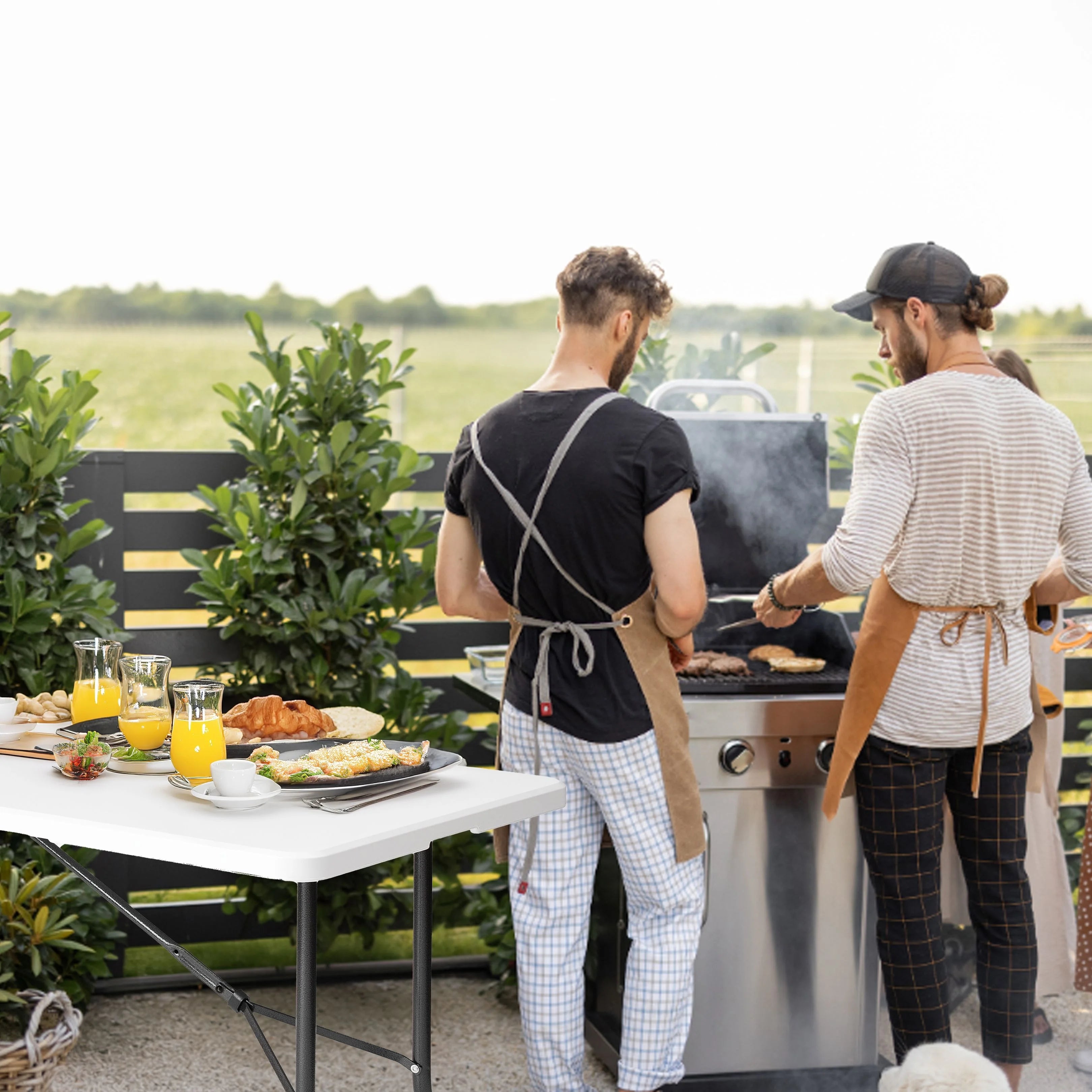 white 6ft folding table in use at outdoor barbecue