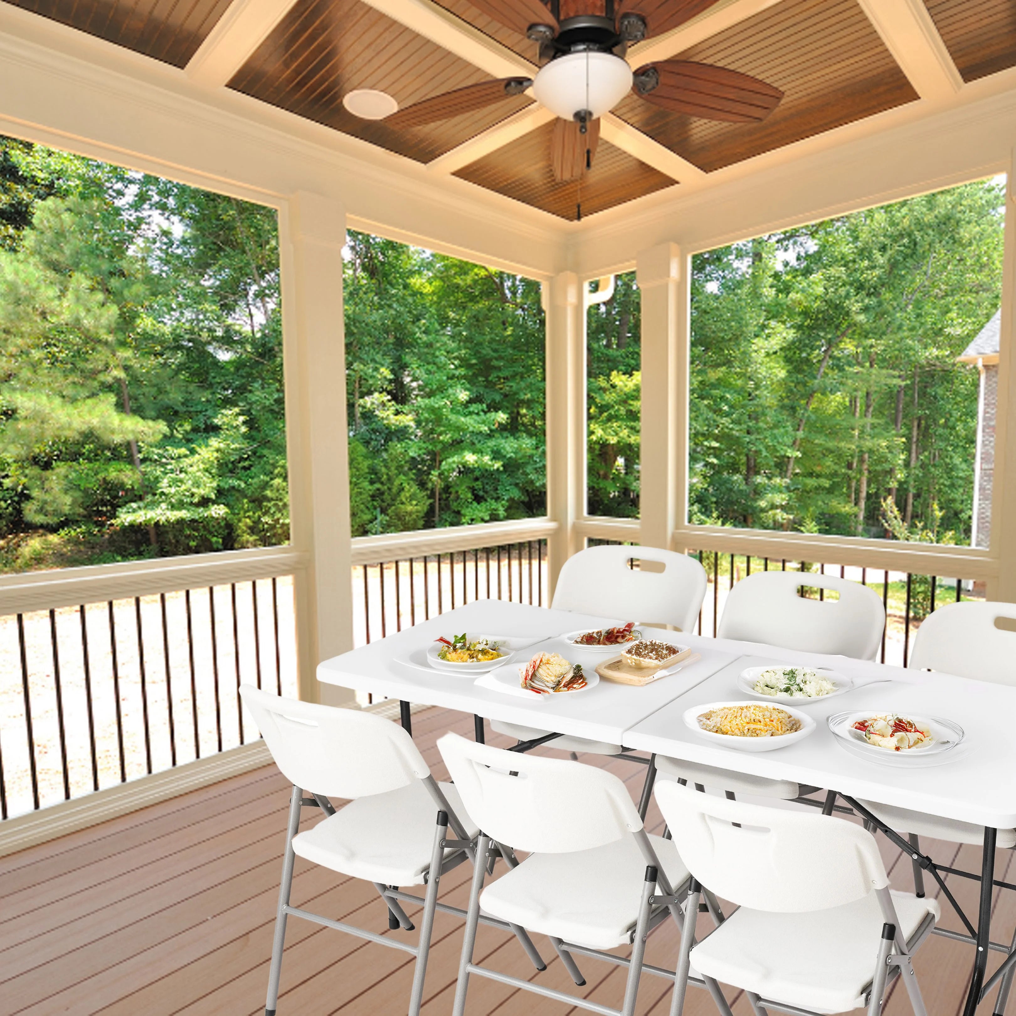 white 6ft folding table and chair in use at an outdoor gathering