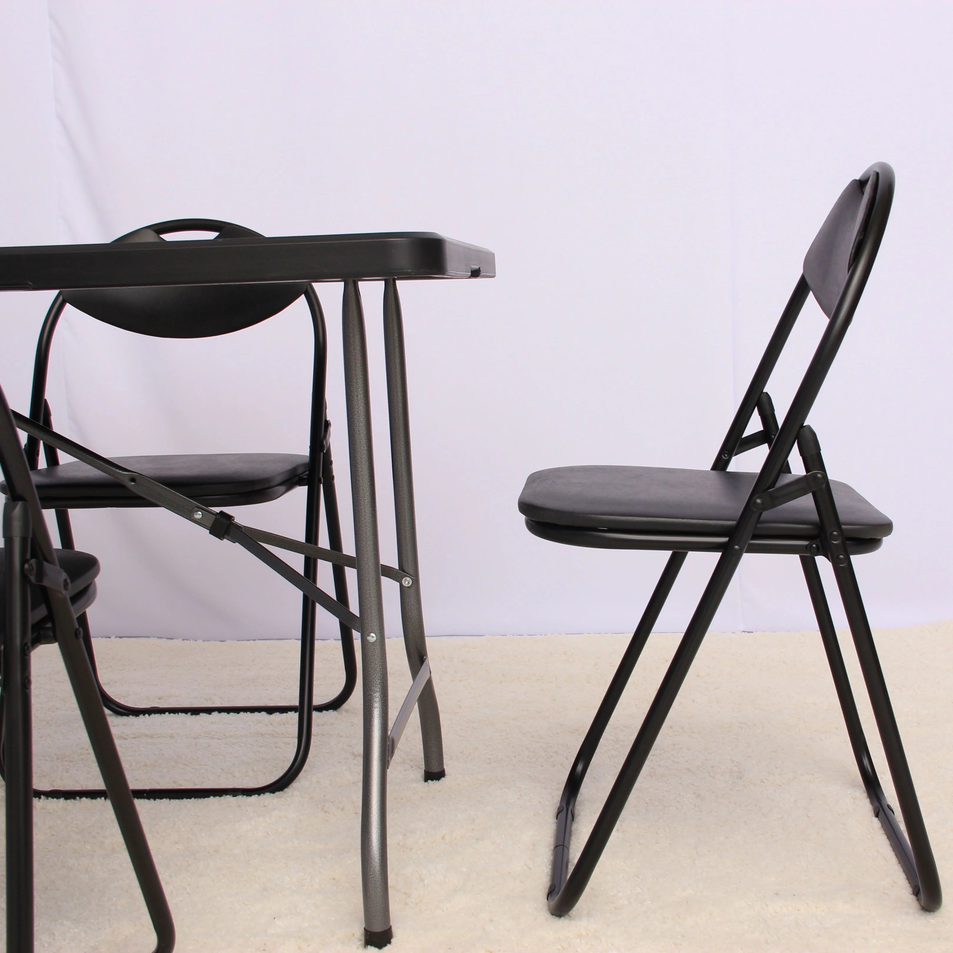 close up of black 6ft folding chairs