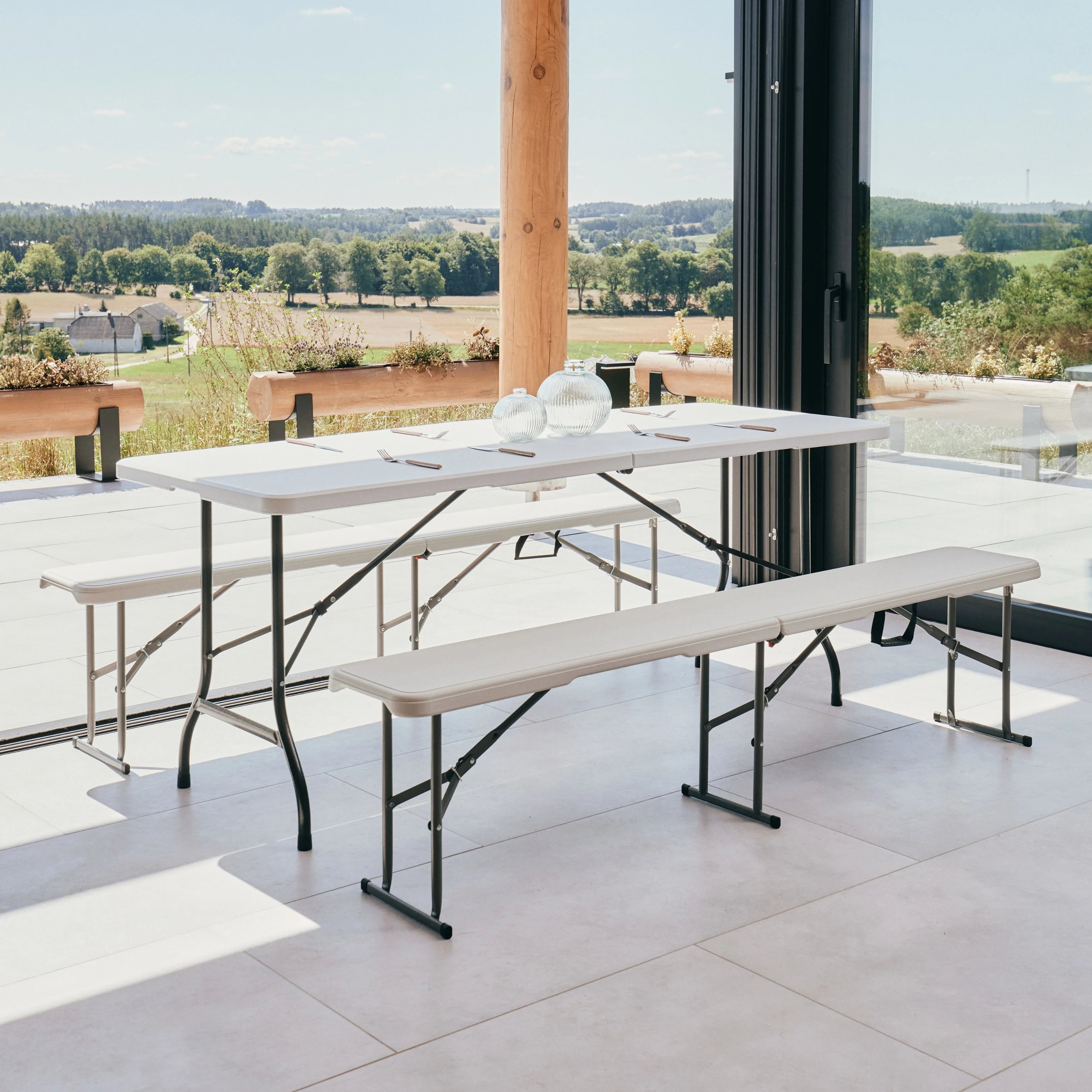 white 6ft folding table and bench on patio with scenic view