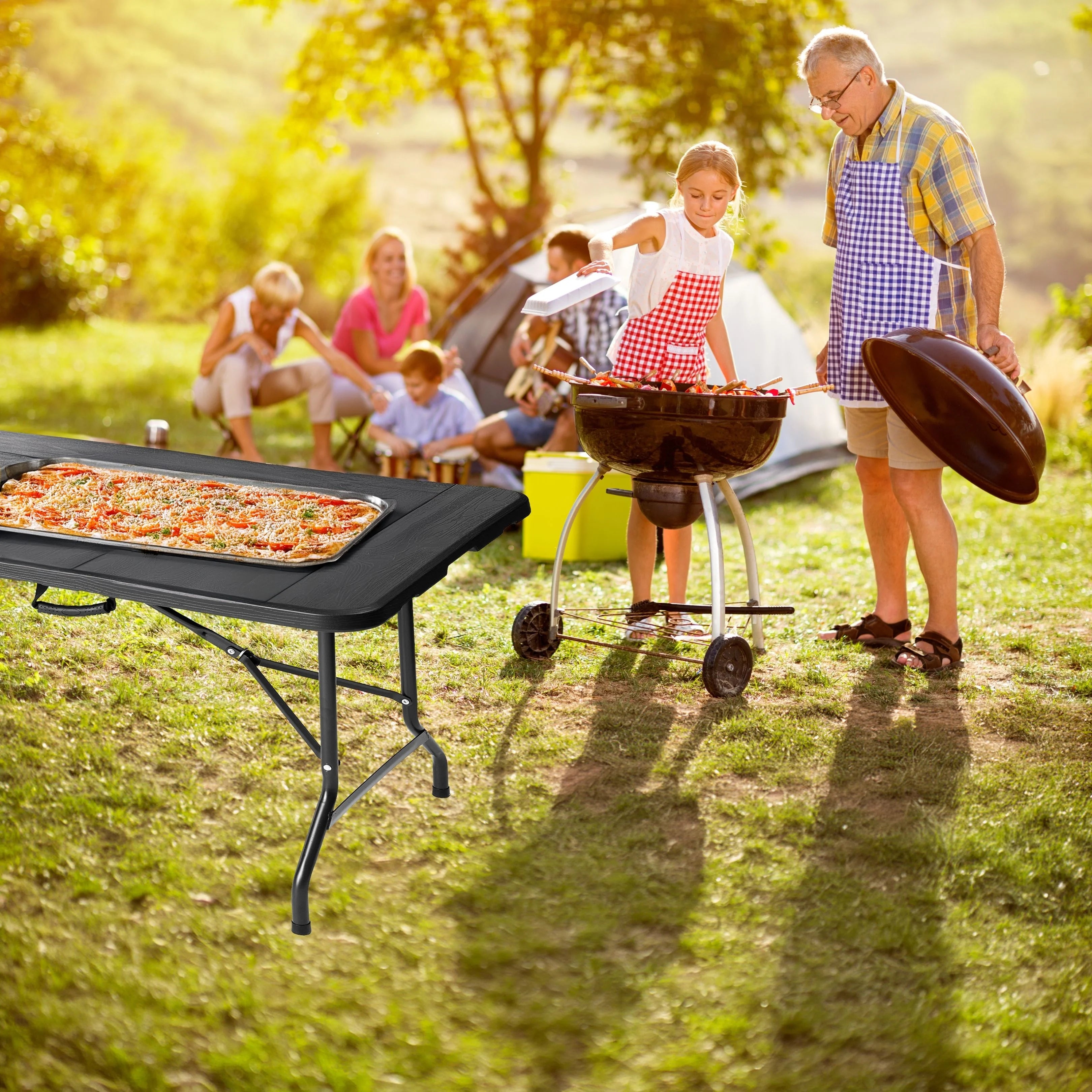 black 6ft folding table in use at outdoor barbecue